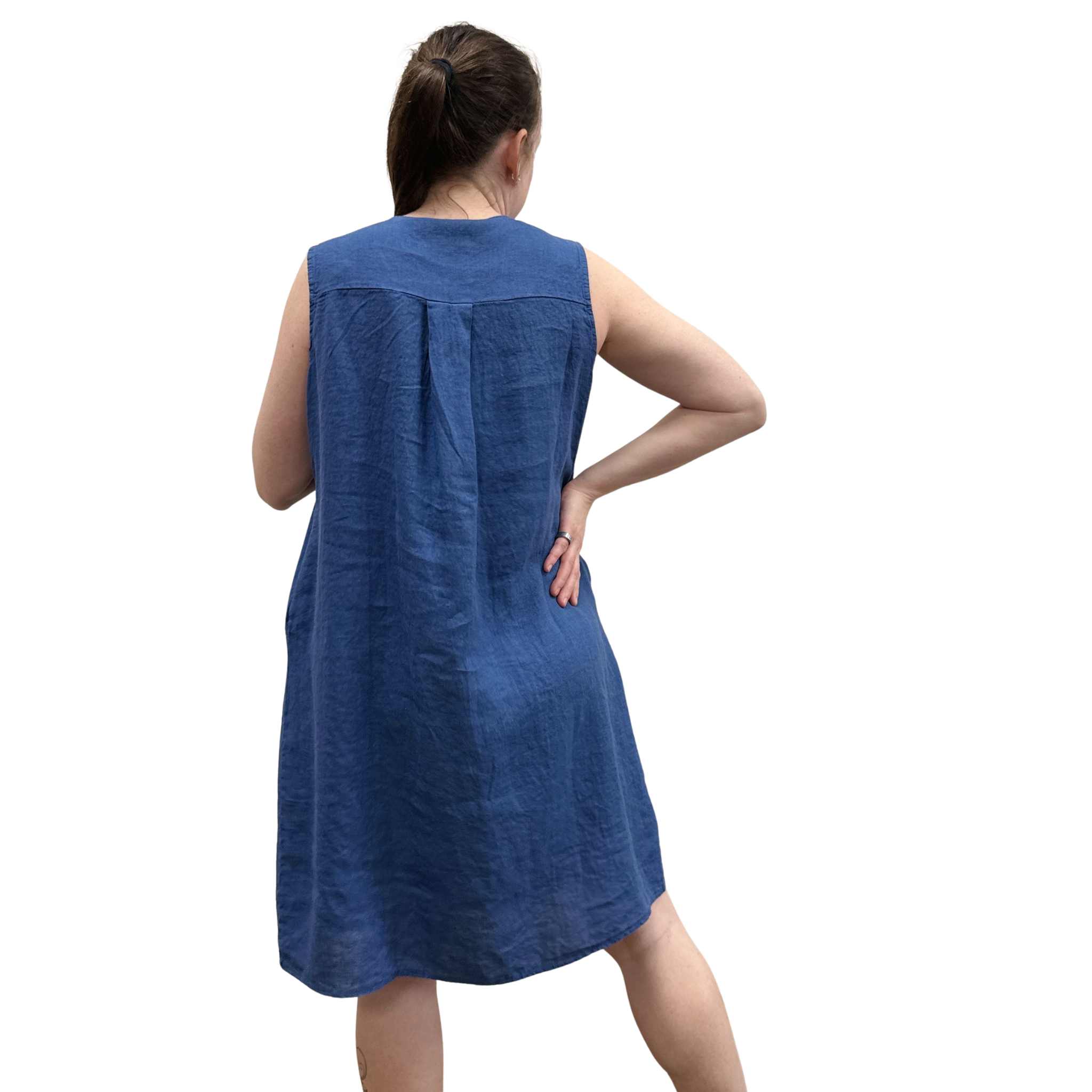 Woman wearing a blue sleeveless dress on a white background