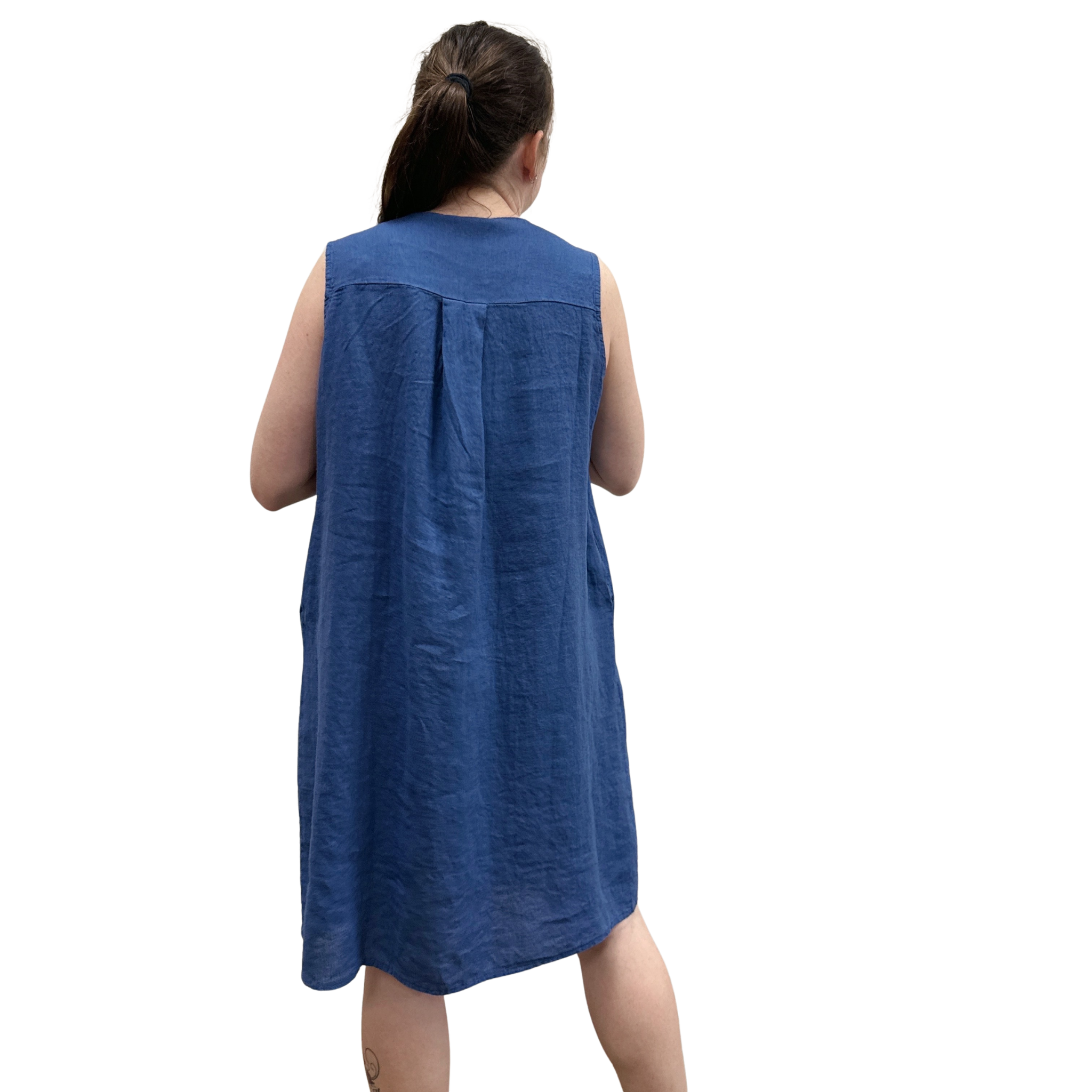 Woman wearing a blue sleeveless dress on a white background