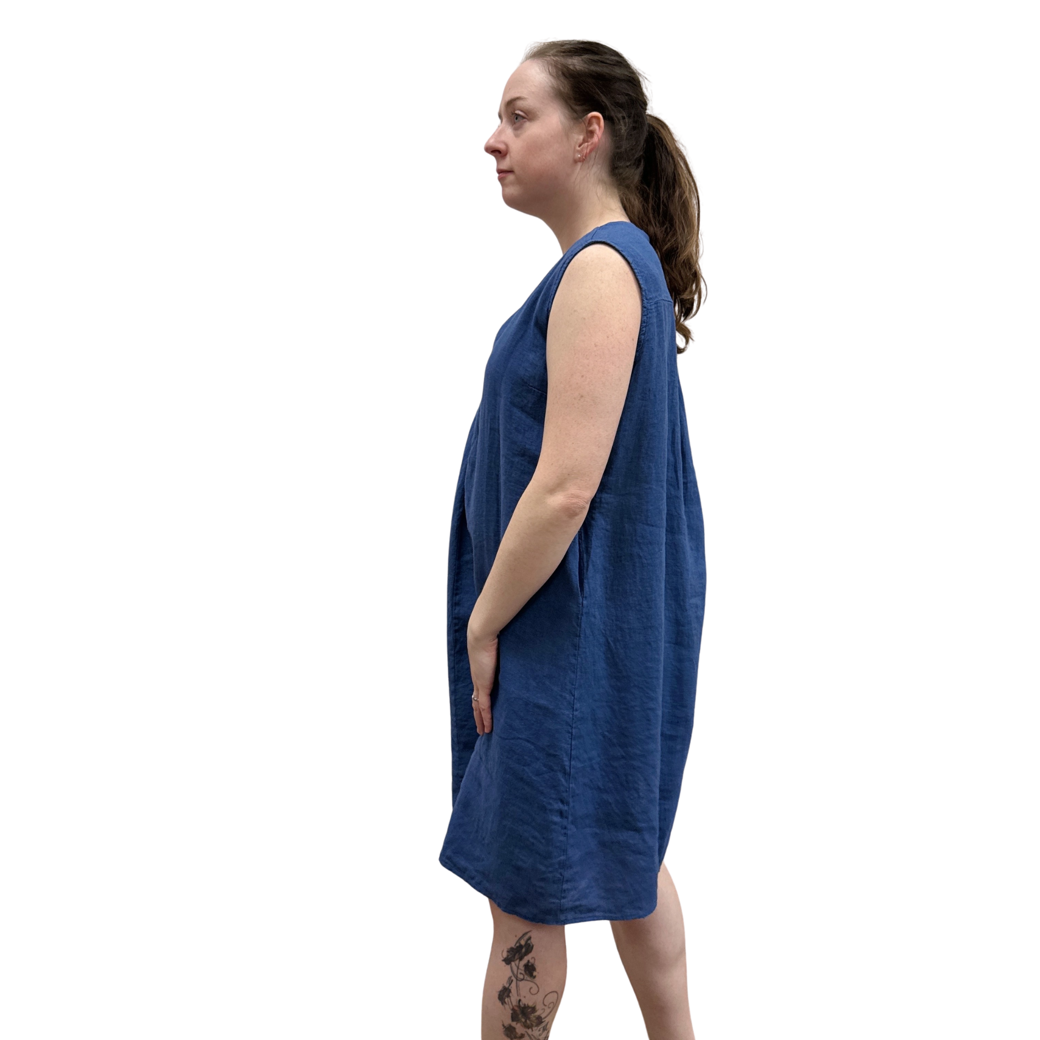 Woman wearing a blue dress against a white background