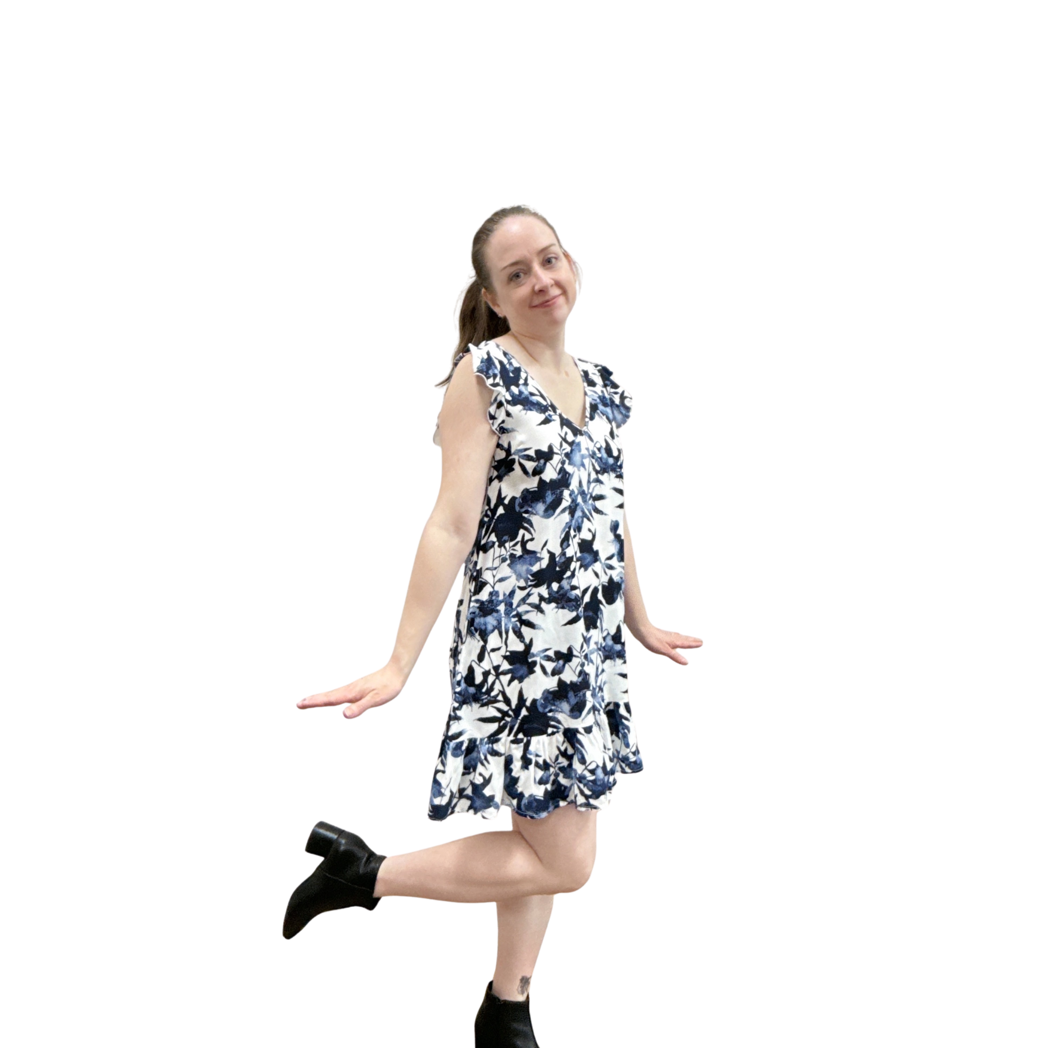 Woman wearing a sleeveless floral dress on a white background
