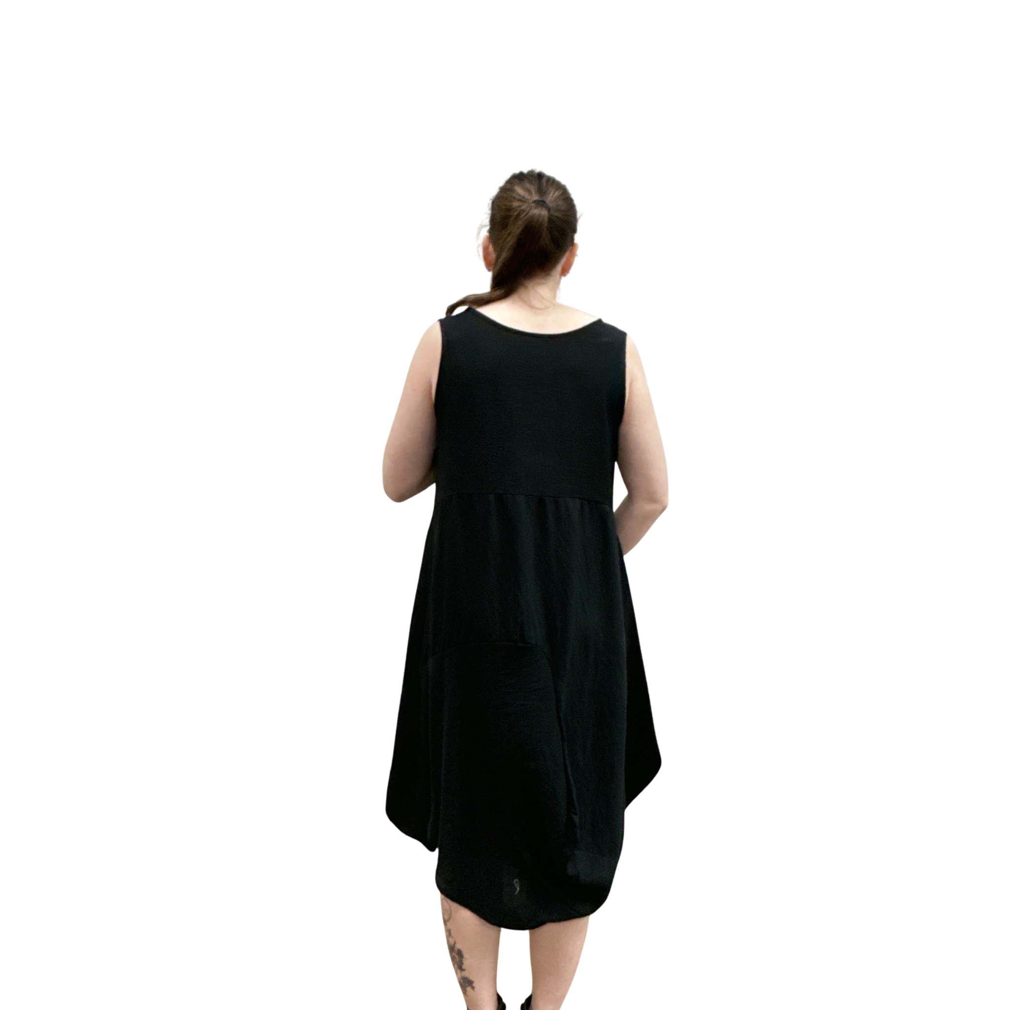 Person wearing a black sleeveless dress on a white background