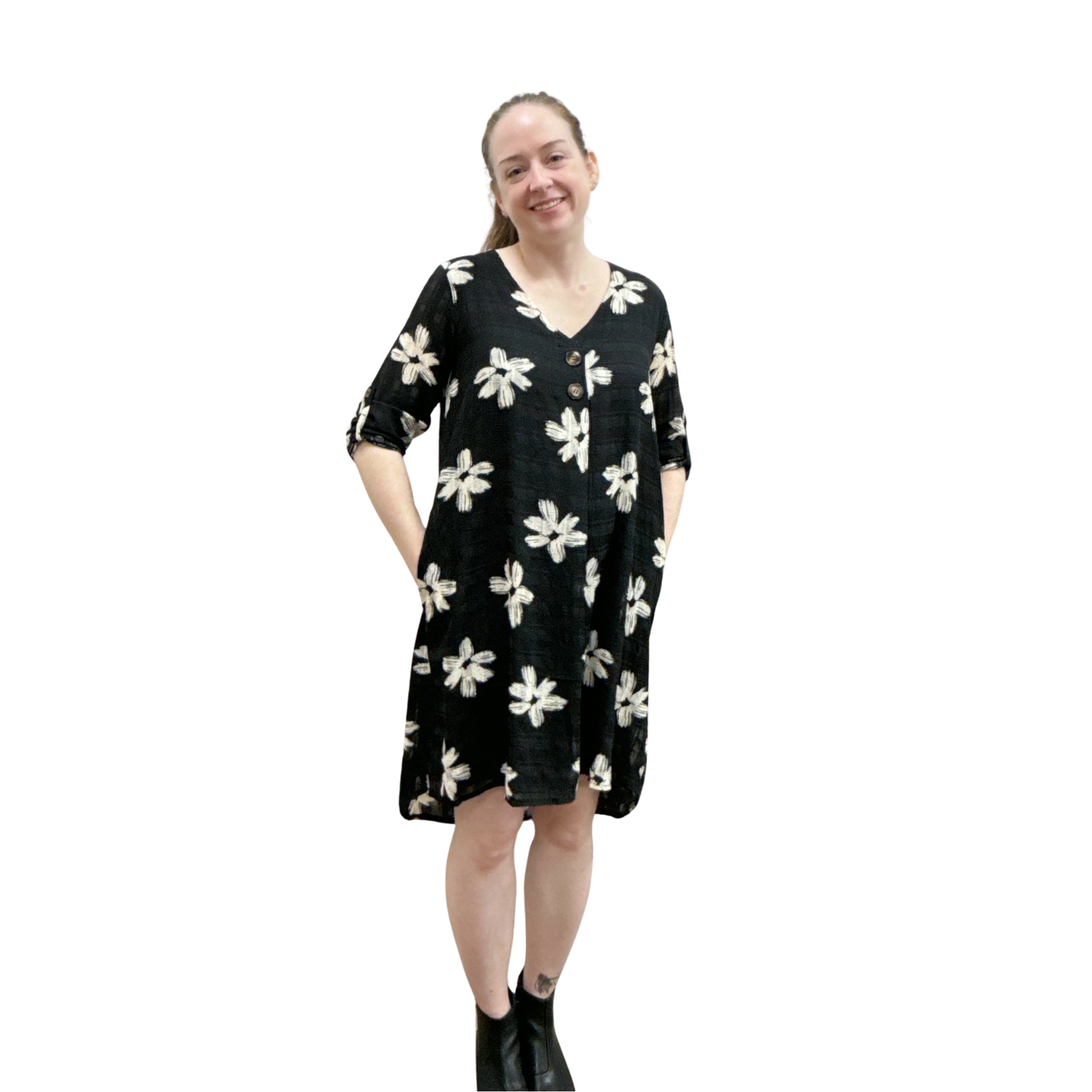 Woman wearing a black floral dress on a white background