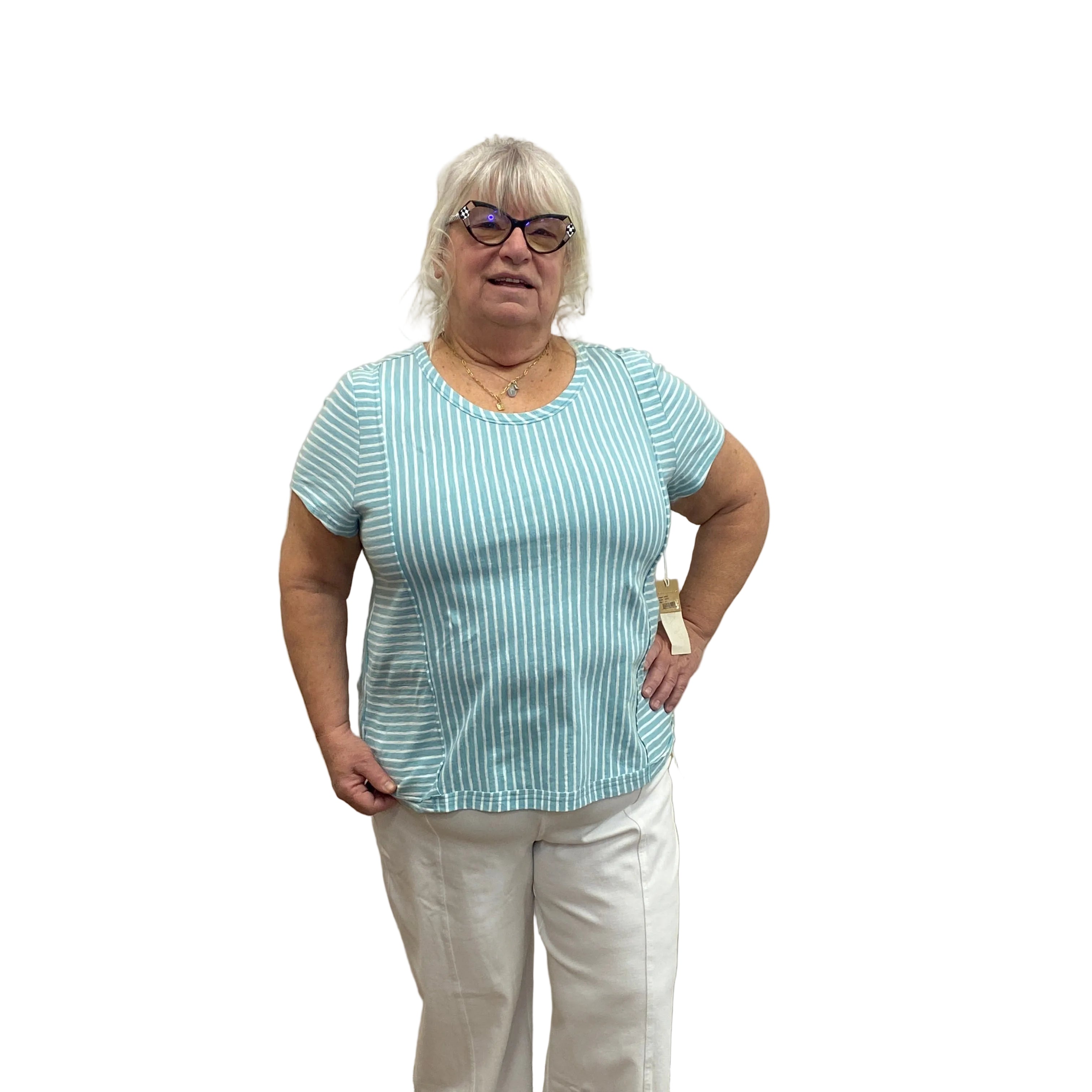 Person wearing a light blue striped Papa T-shirt and white pants on white background.