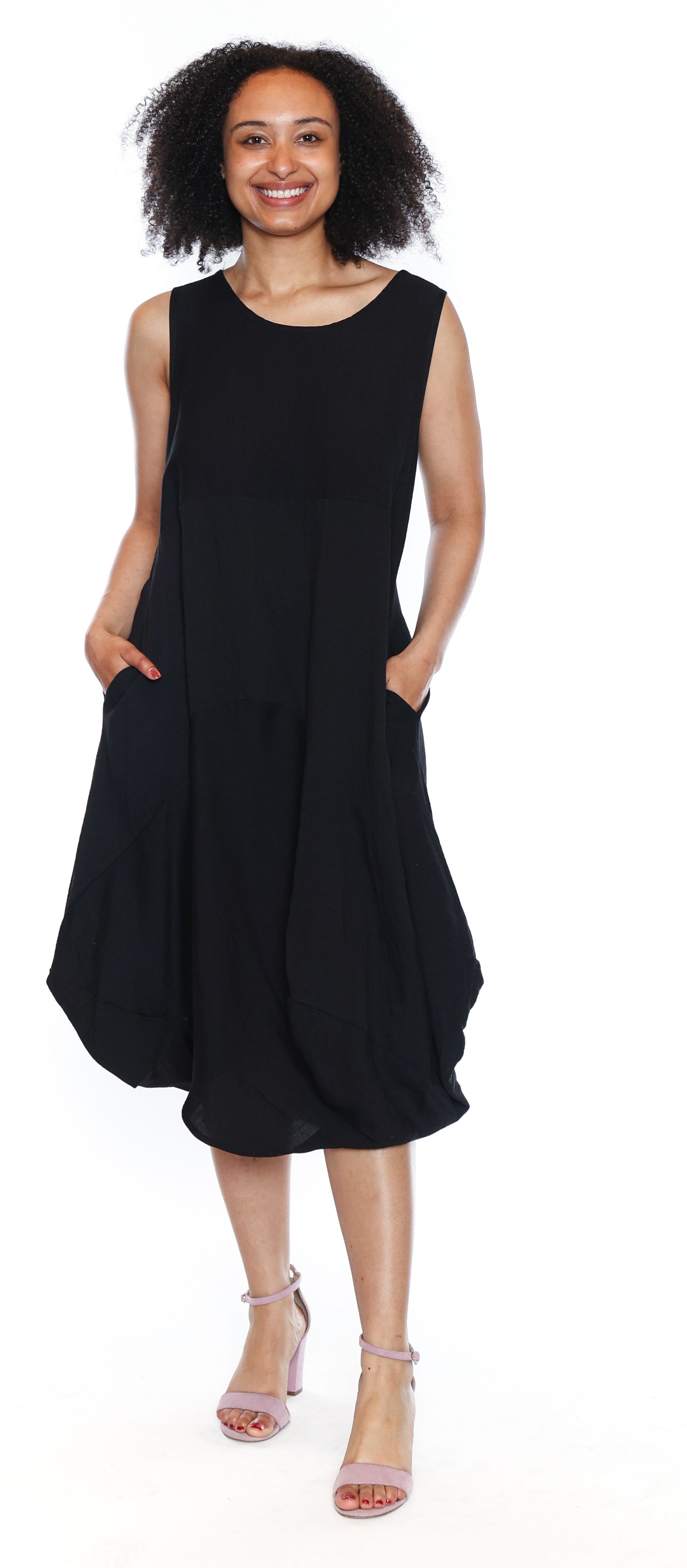 Woman wearing a black sleeveless dress on a white background