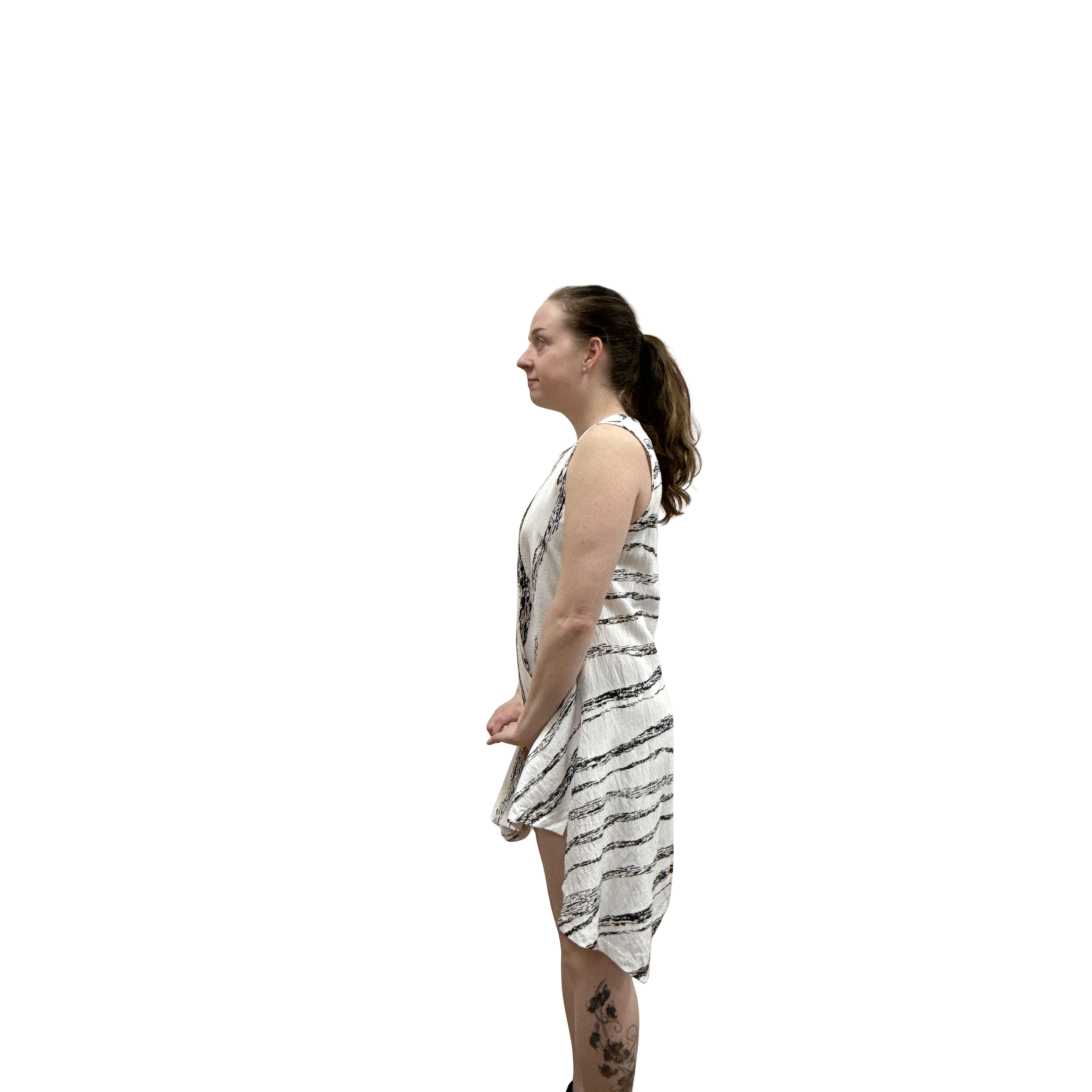 Woman wearing a sleeveless dress with a zebra pattern on a white background