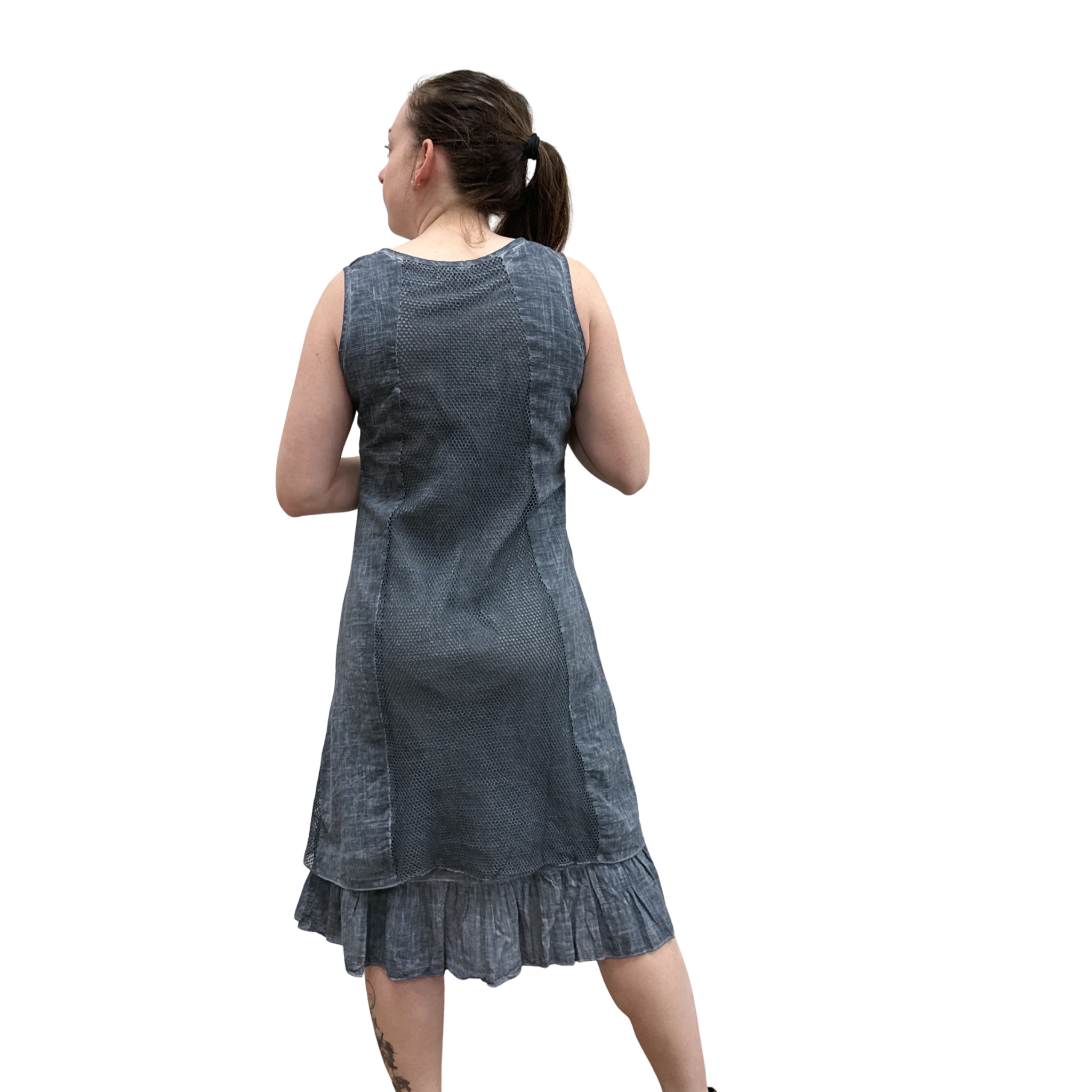 Woman wearing a denim dress on a white background