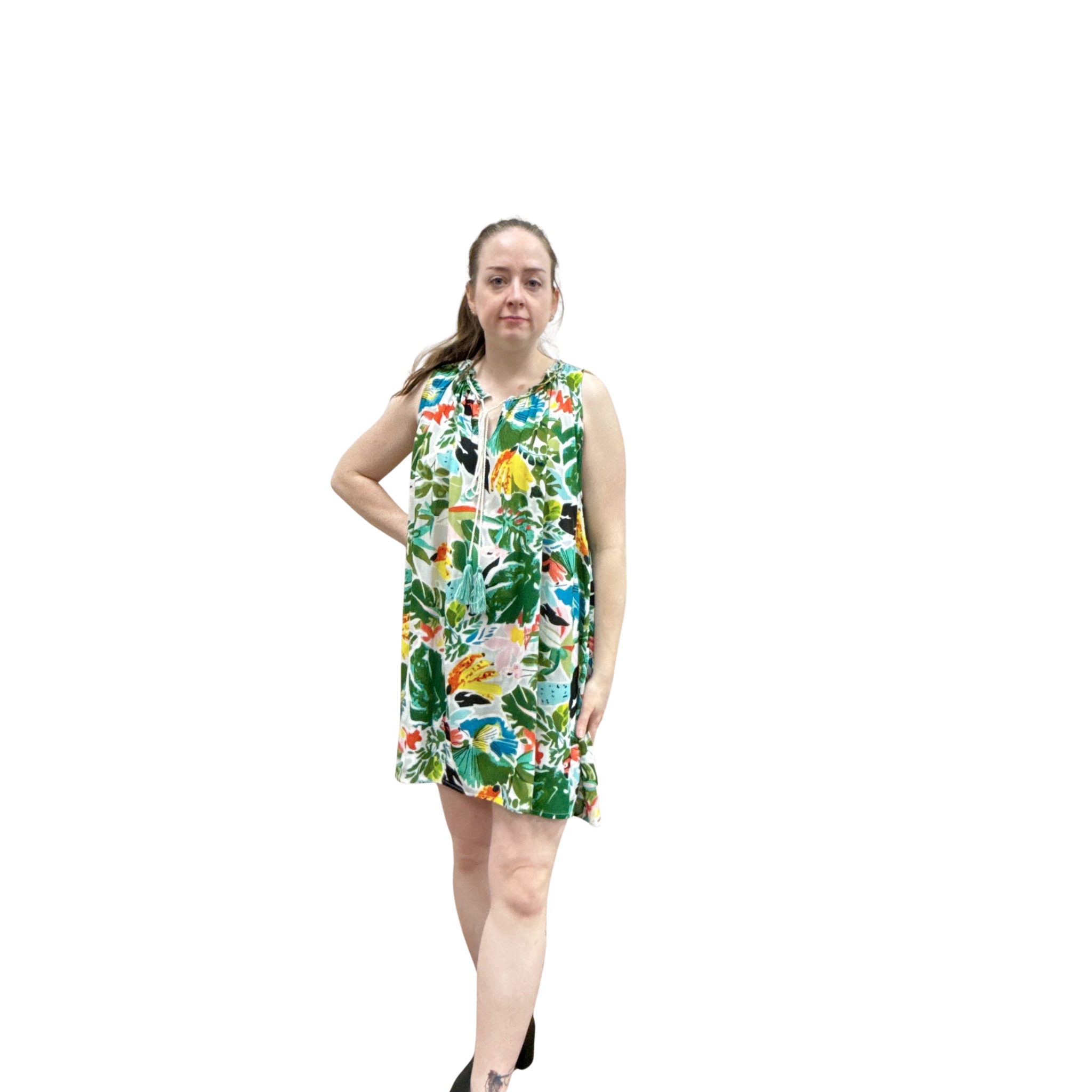 Woman wearing a colorful floral dress on a white background