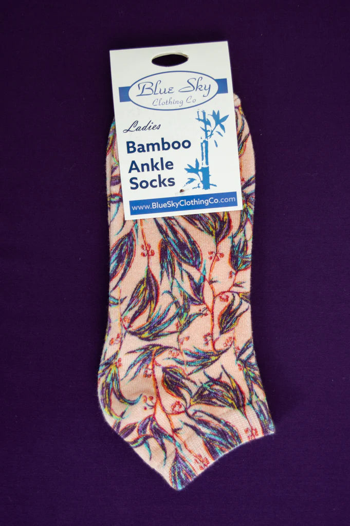 Packaged bamboo ankle socks with floral pattern on a purple background