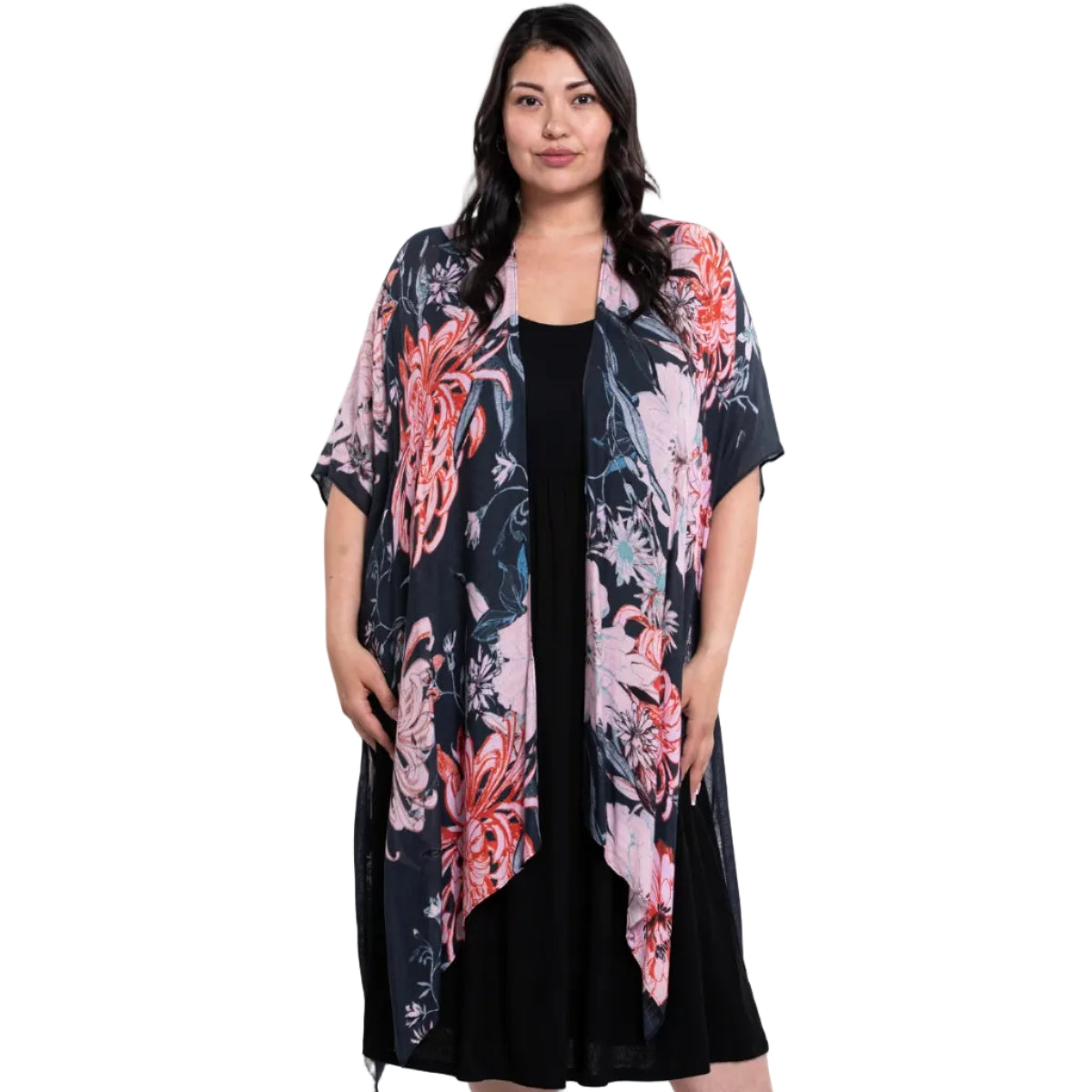 Woman wearing a blue skysdarcy floral kimono over a black dress on a white background