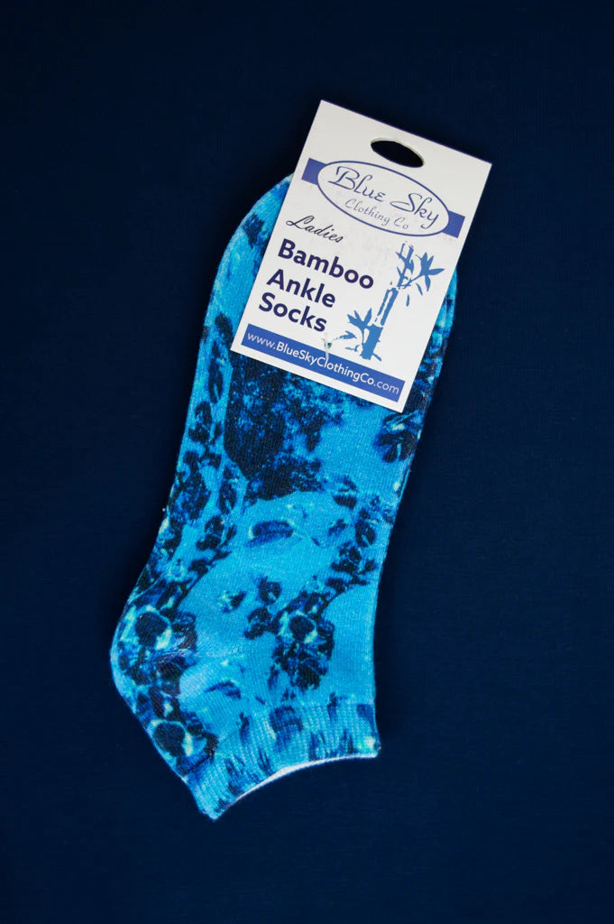 Blue bamboo ankle socks with packaging on a dark blue background