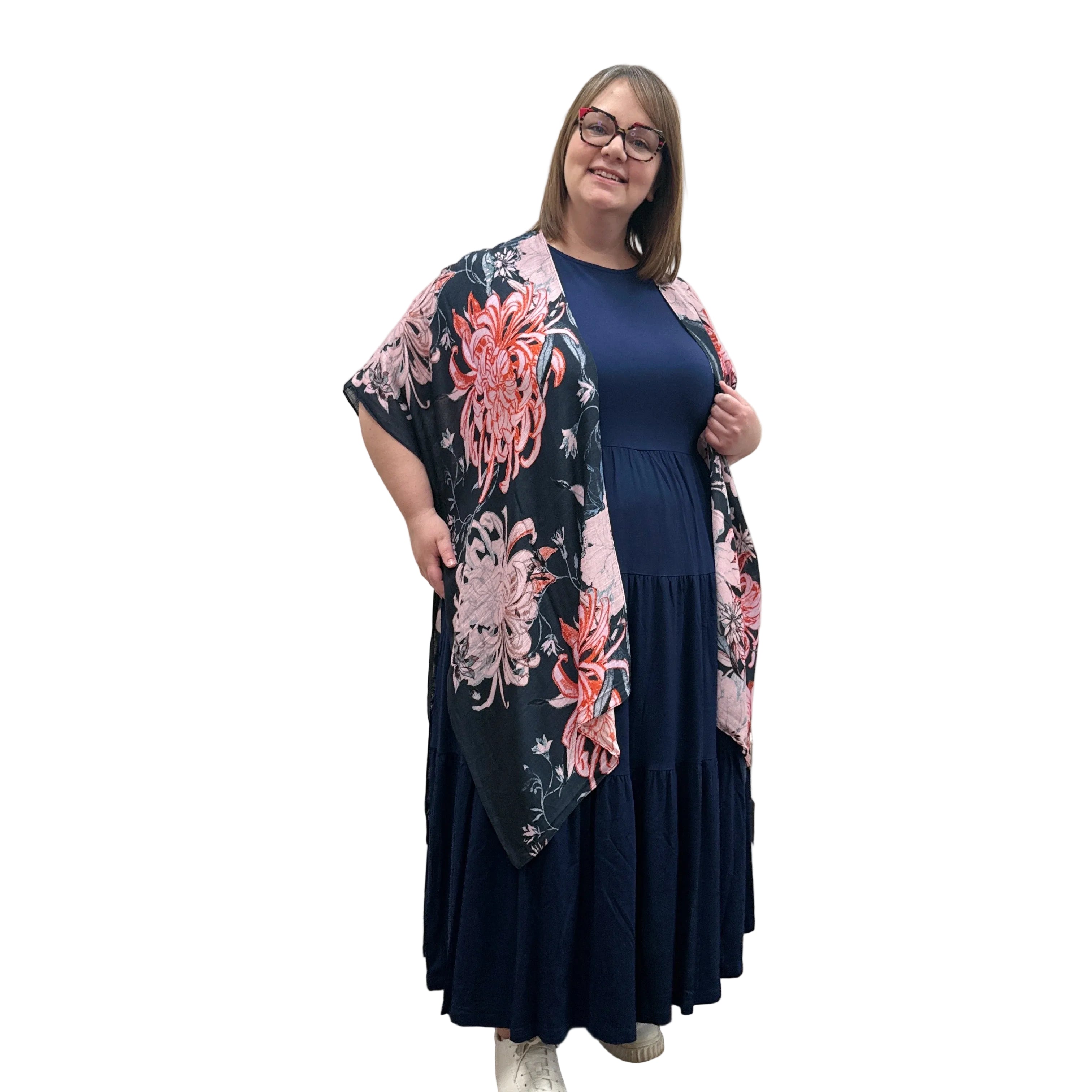 Woman wearing a floral Blue Sky Darcy kimono on a white background.