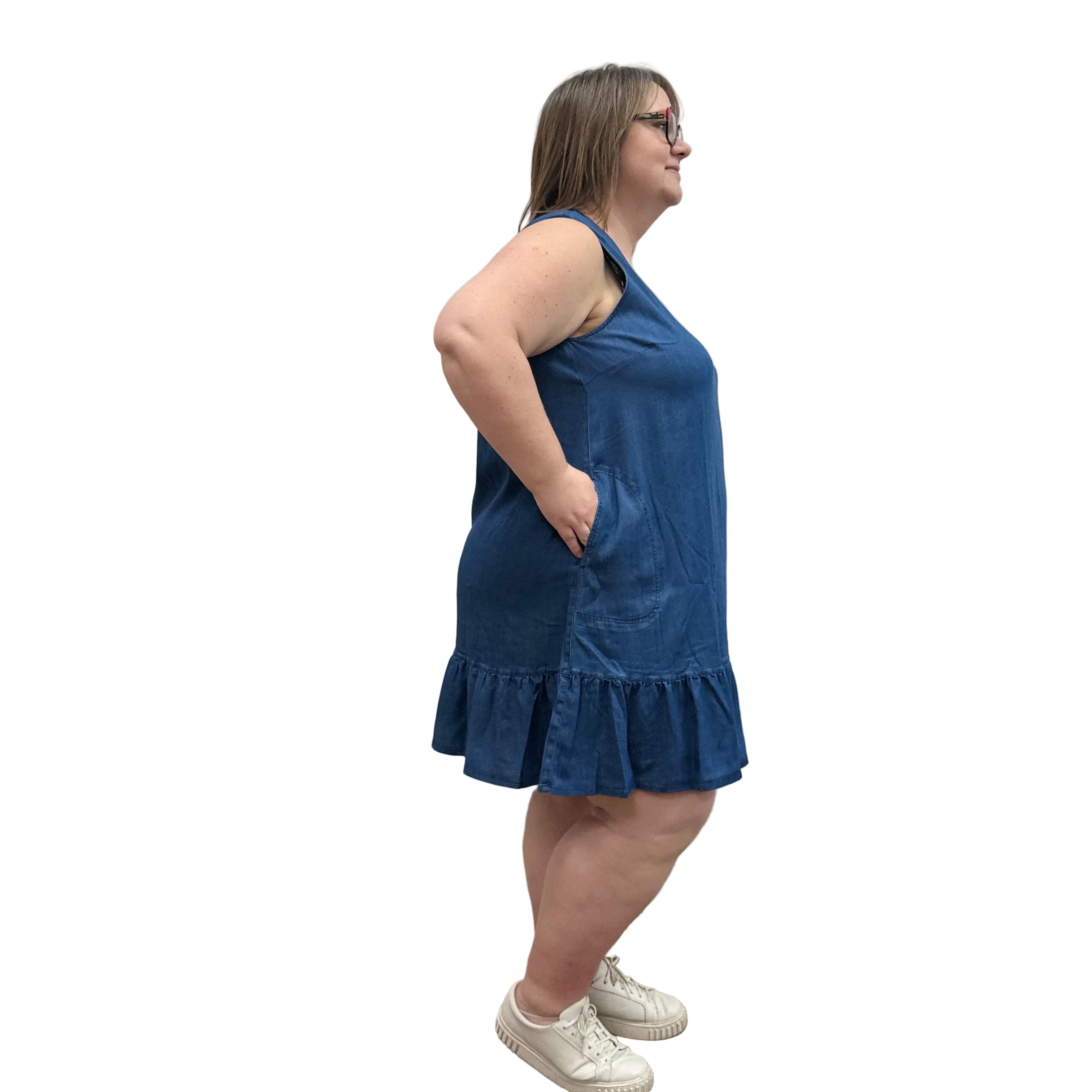 Woman wearing a Denim Blue Sky Lali Dress on white background.