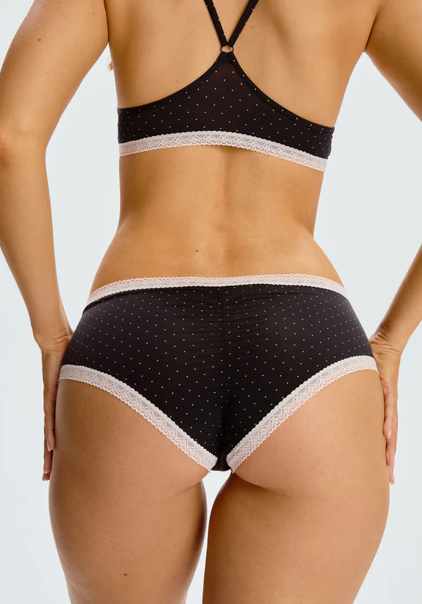 Back view of the "Micro Hipster" panty from Blush, showcasing its delicate and chic design. The panty is low-rise with cheeky coverage, adorned with a subtle polka dot pattern and elegant lace trim.