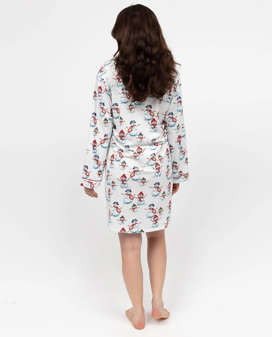 Person wearing a patterned pajama set on a white background