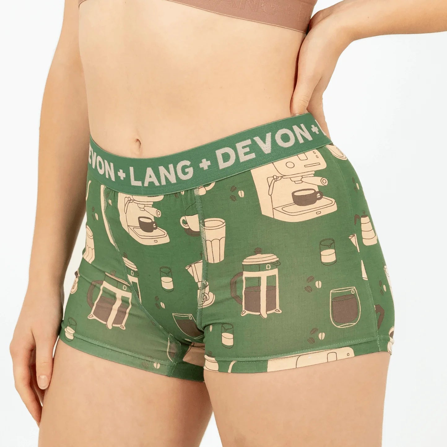 Green underwear with coffee-themed design and 'Devon + Lang' branding on a white background