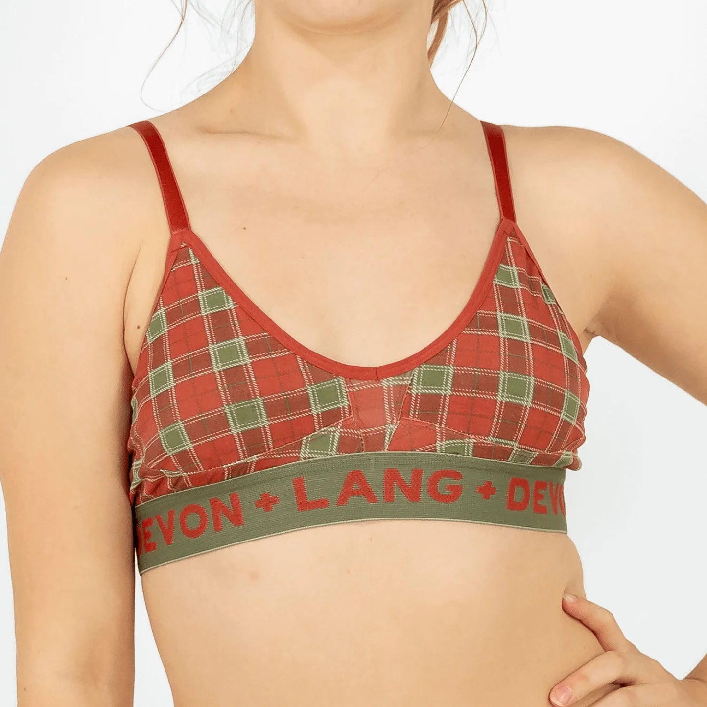 Red plaid bra with green band featuring text on a white background