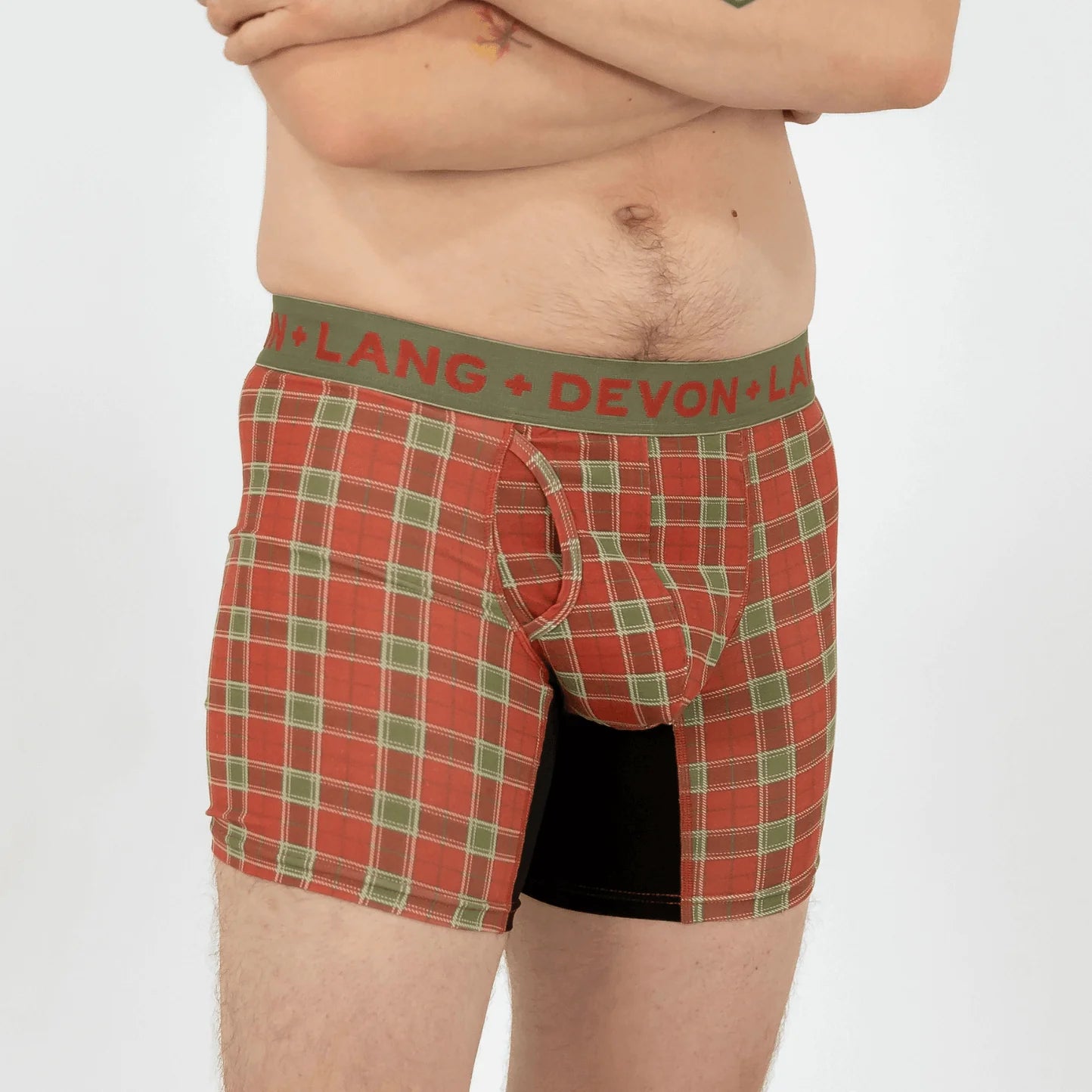 Red plaid boxer briefs with green waistband featuring 'Devon + Lang' brand on a white background.