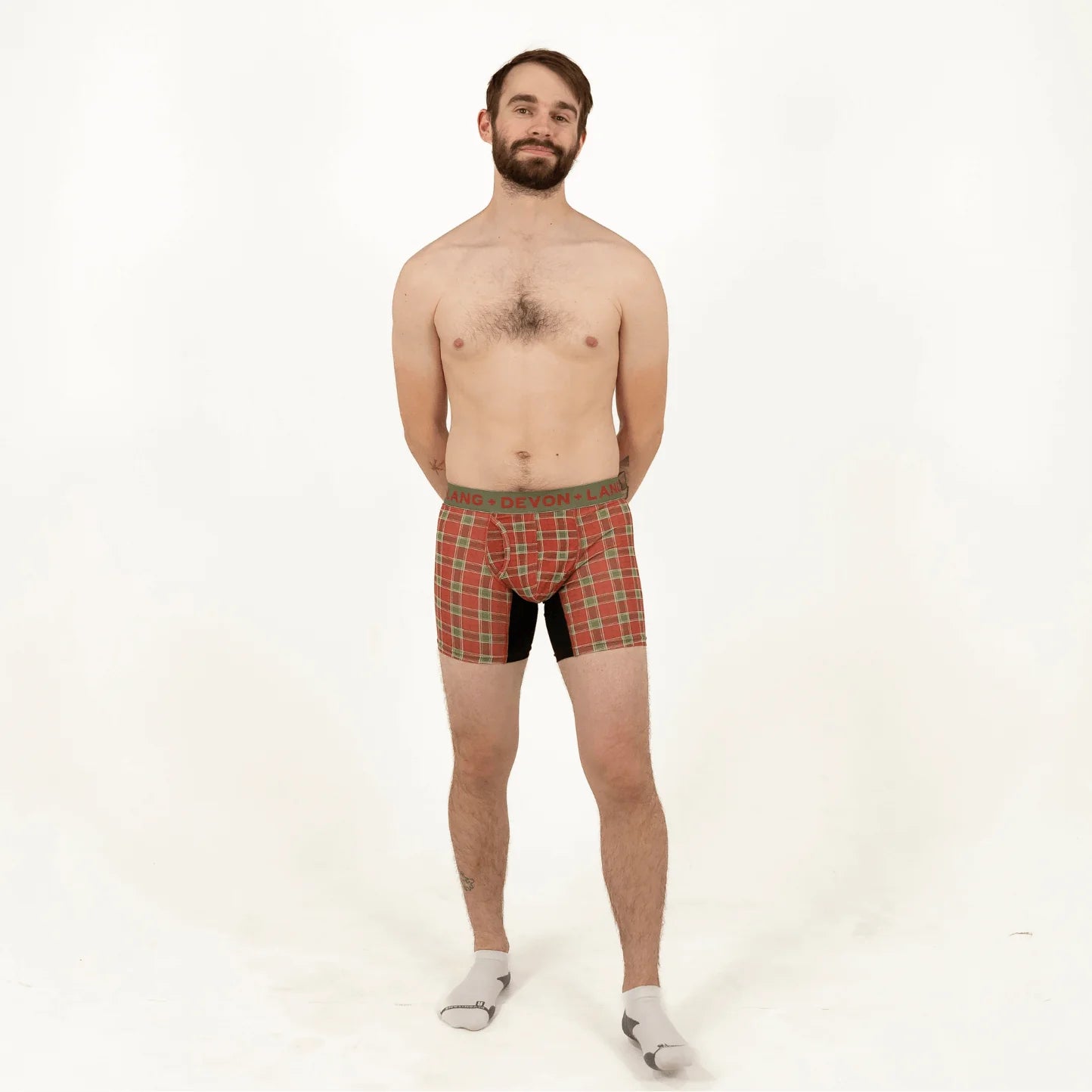 Man wearing plaid underwear on a white background