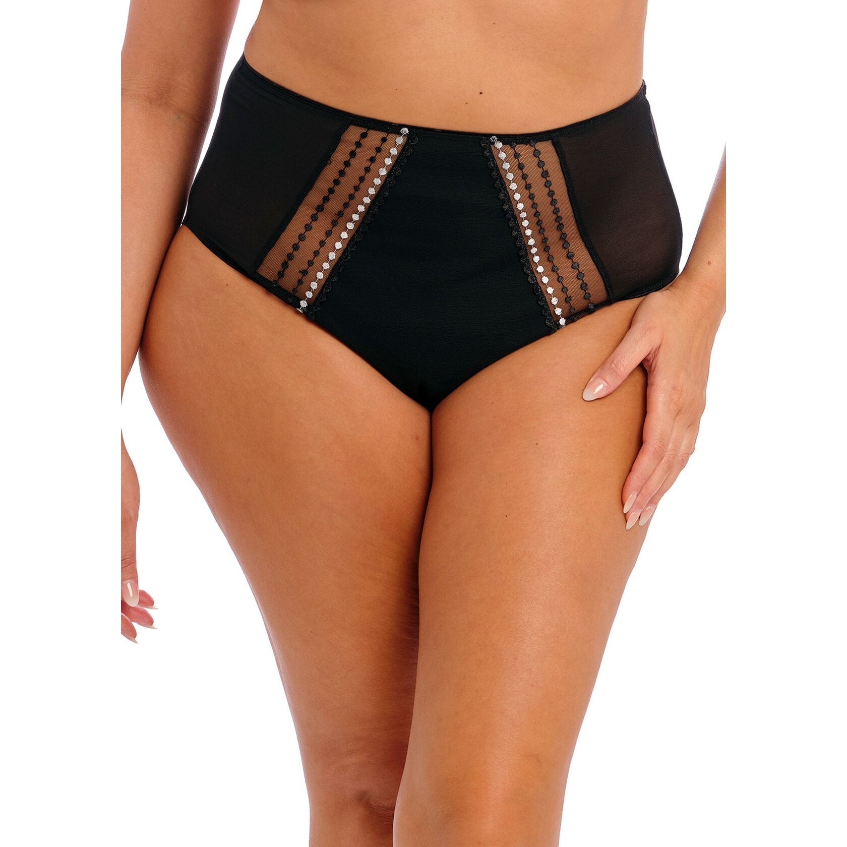 A person wearing a black panty with white and black polka dot details.