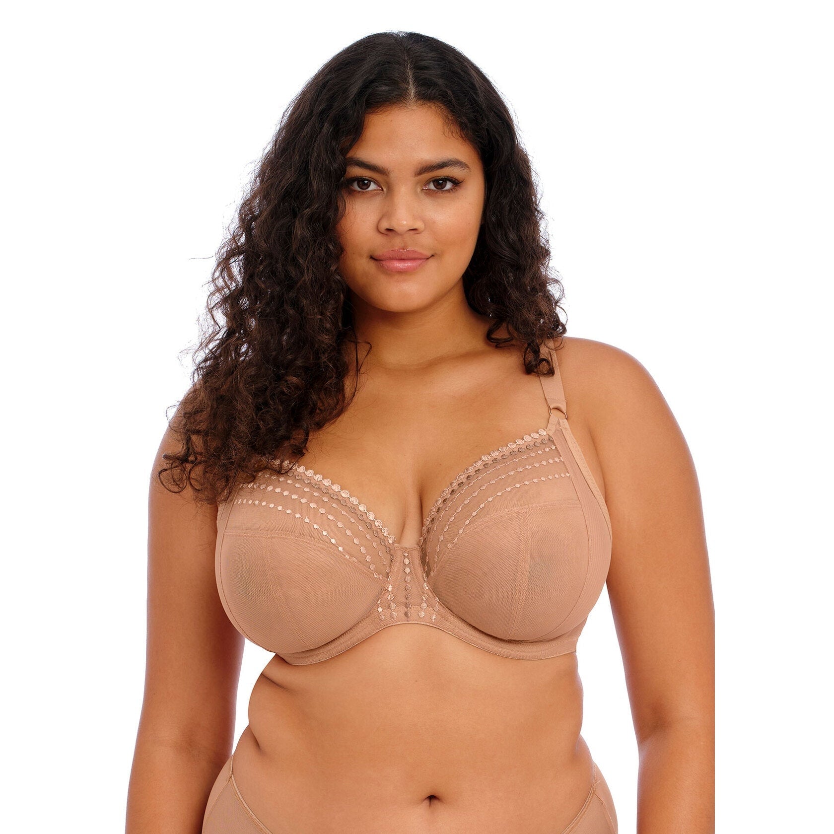 A women wearing a beige bra against a white background.