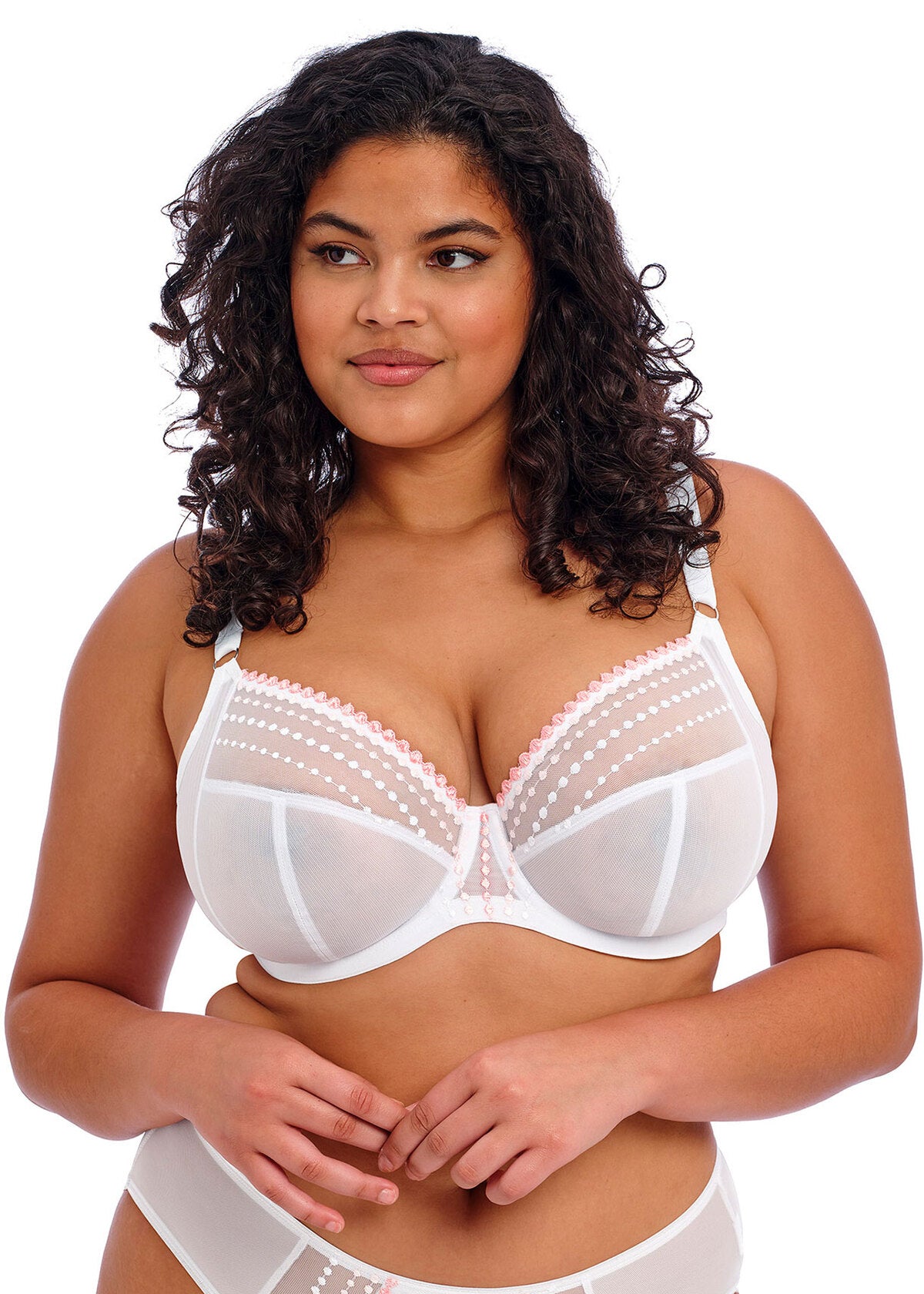 Woman wearing a white bra and panties set on a white background