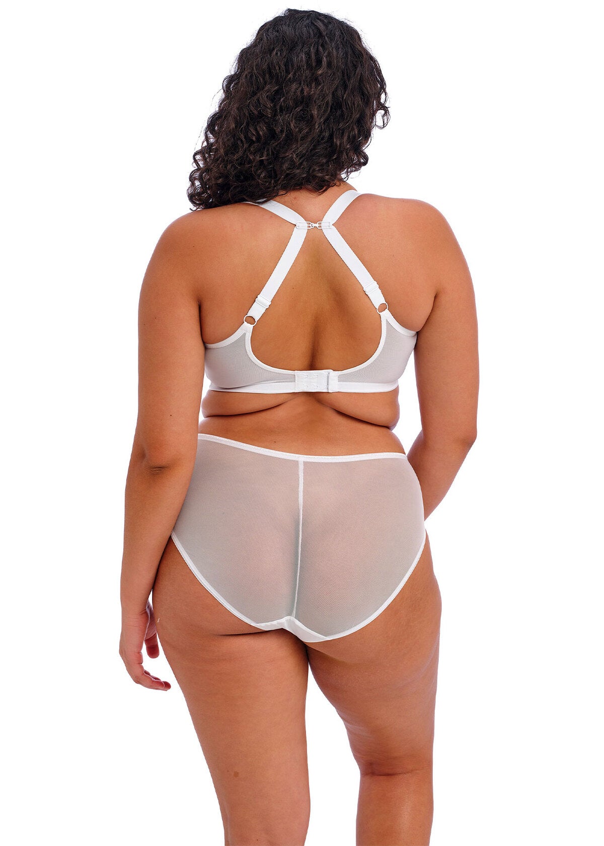 Woman wearing a white bra and underwear set on a white background