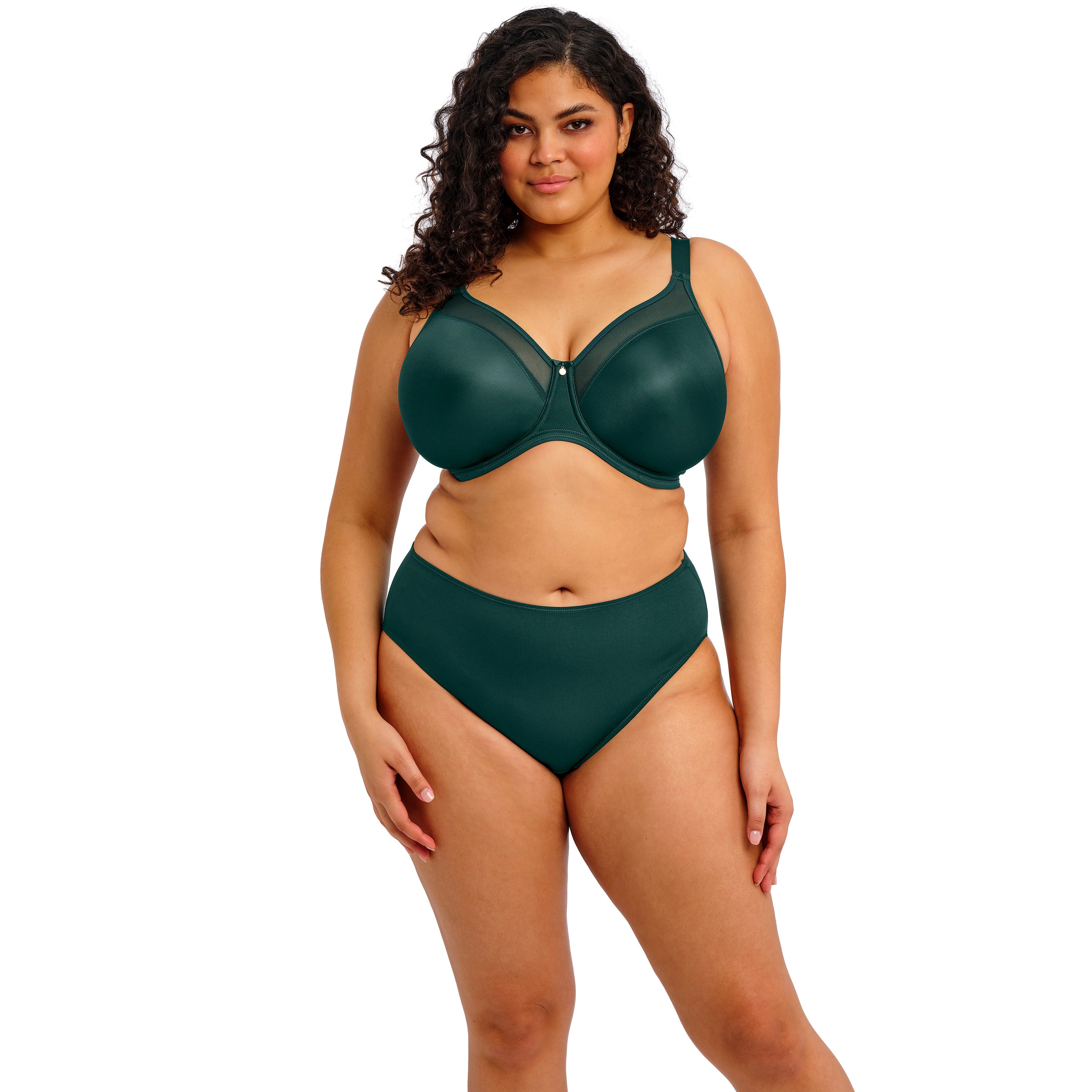 Woman wearing a green bikini set on a white background