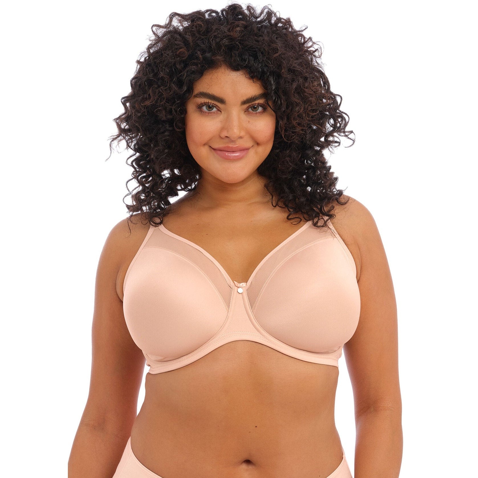 Women wearing a smooth beige bra against a white back ground.