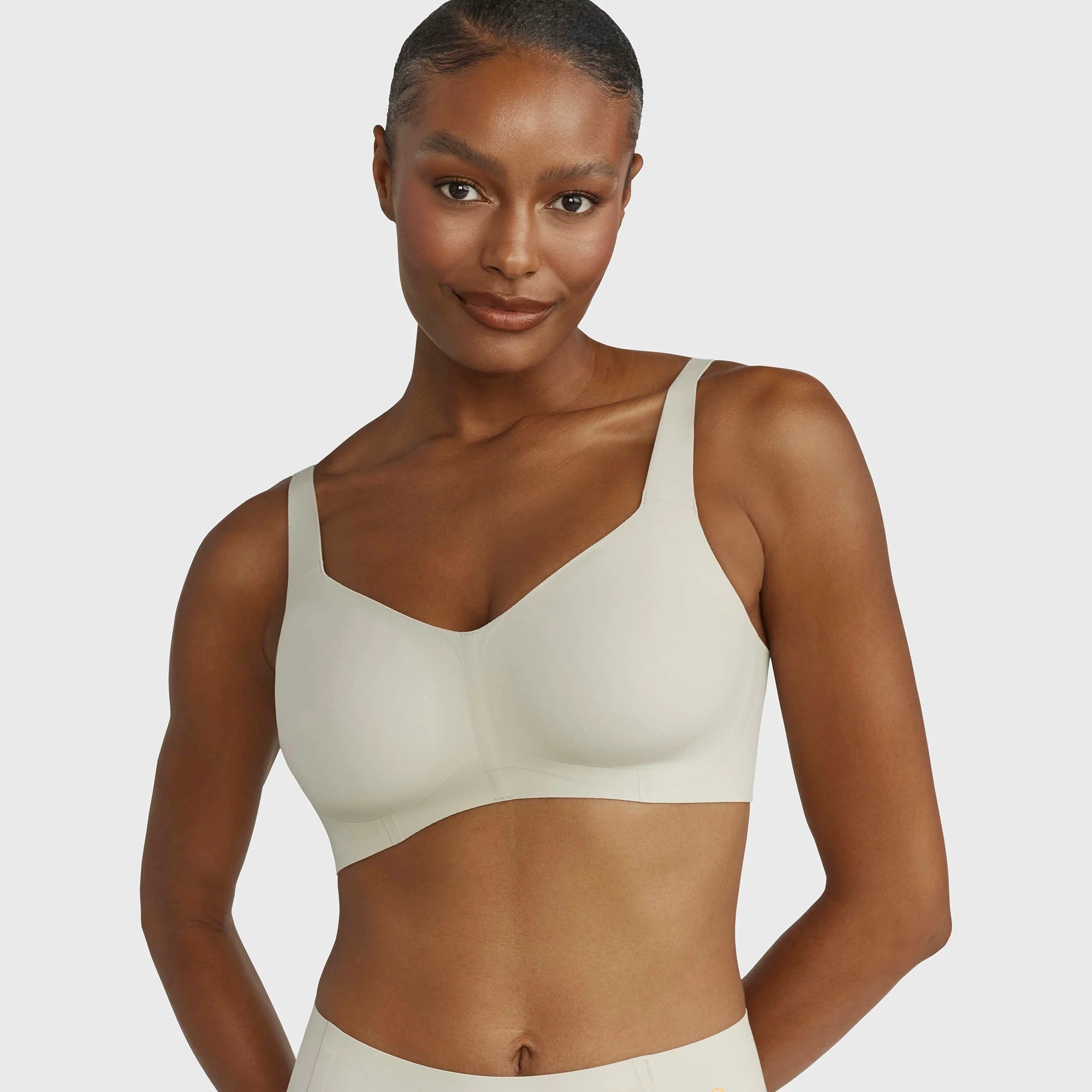 Beyond Bra in Aloe, light sage green wirefree bra shown on a model facing the front.