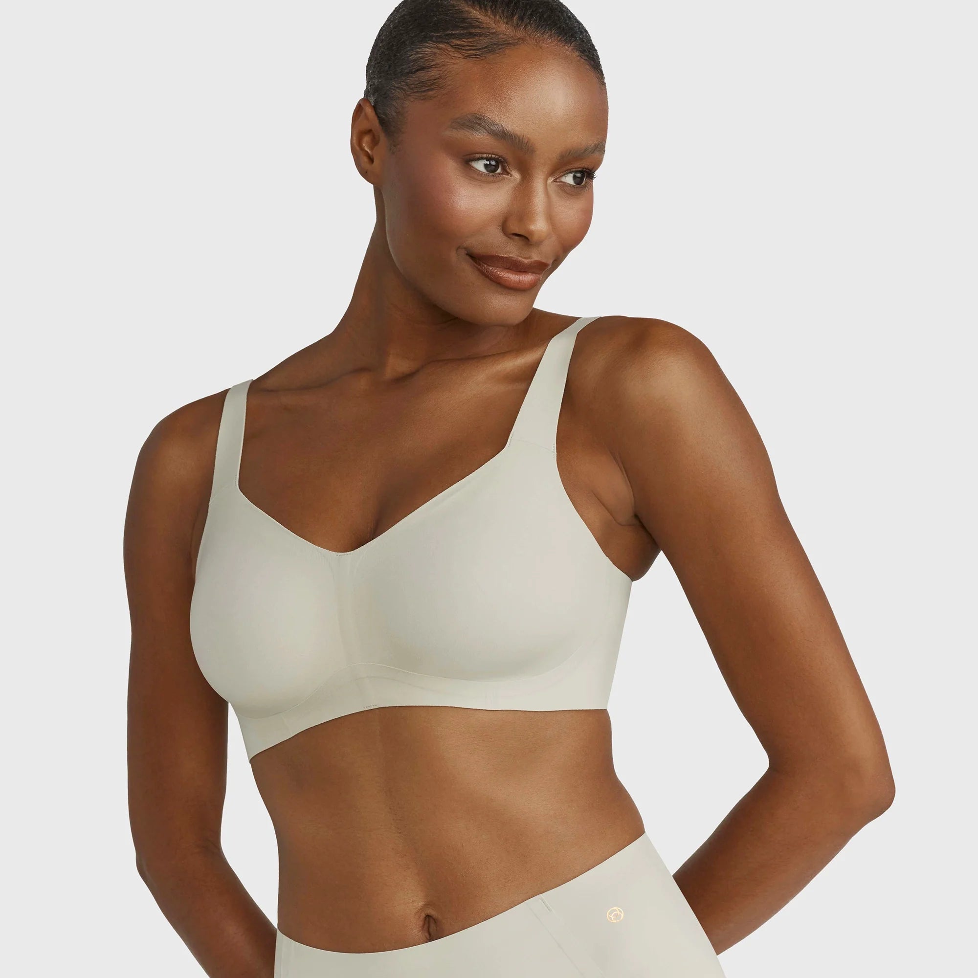 Beyond Bra in Aloe, light sage green wirefree bra shown on a model front view.