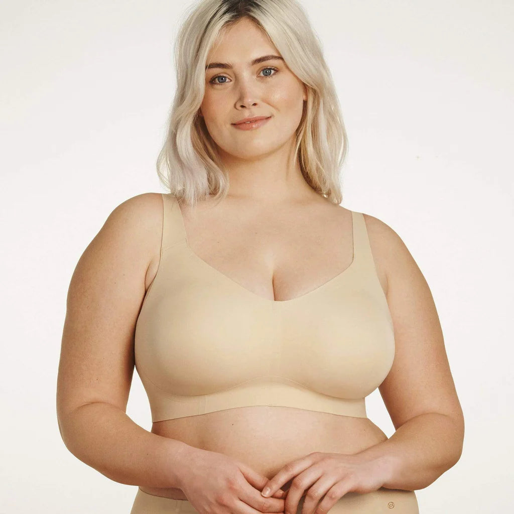 Beyond Bra in Sand, beige wirefree bra shown on a model from the front view.