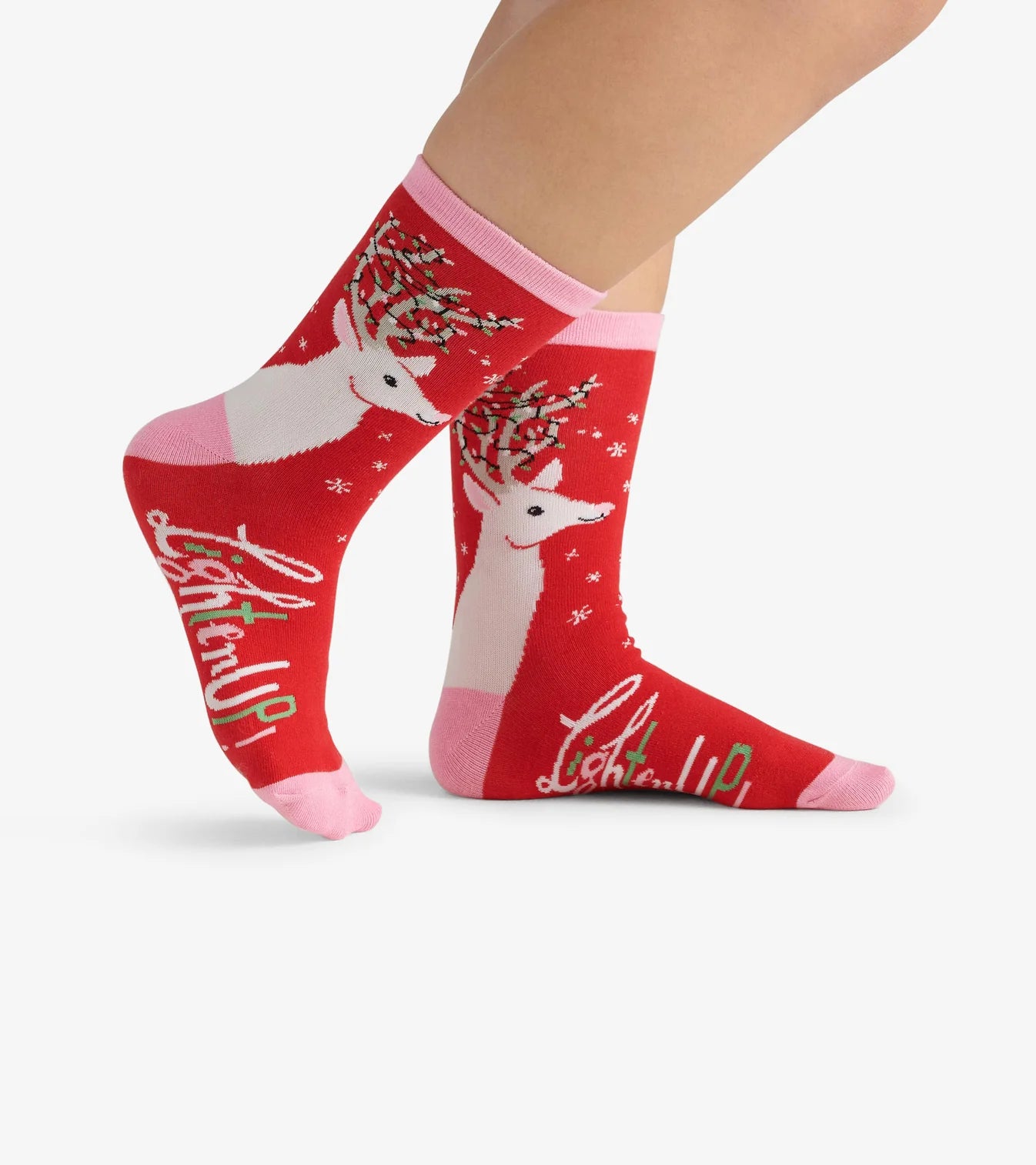 Red socks with reindeer design and 'Lighten Up!' text on a white background