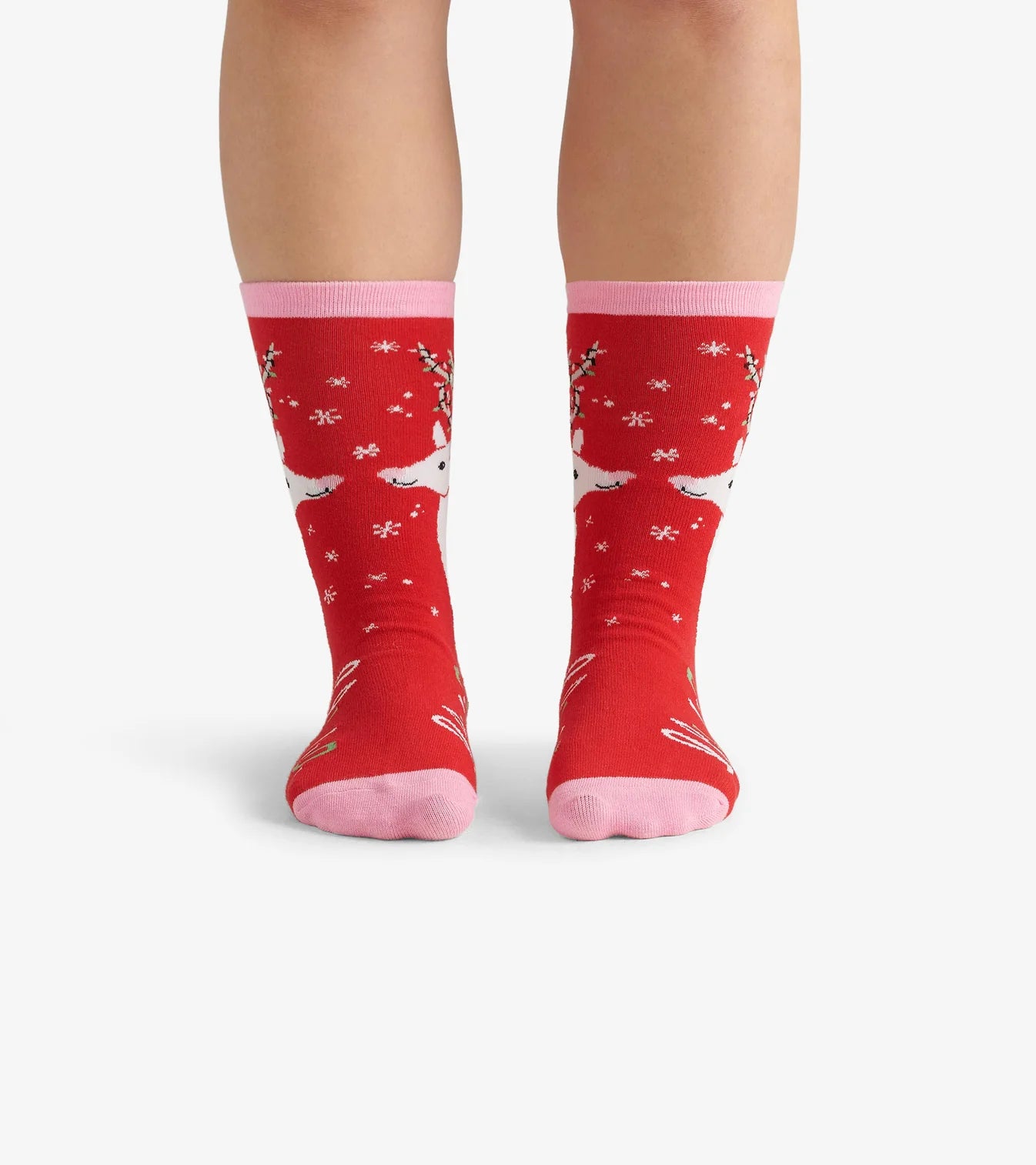 Red socks with pink accents worn by a person on a white background