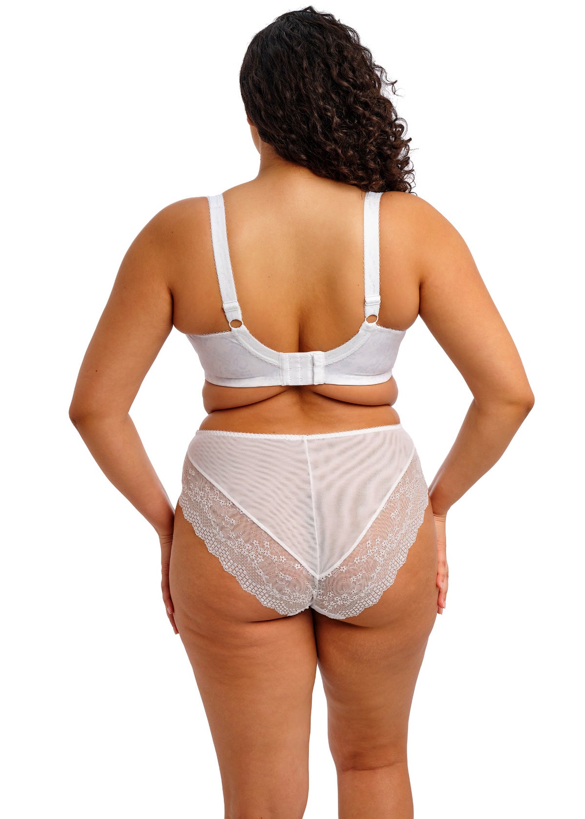 Woman wearing a white bra and panties set on a white background