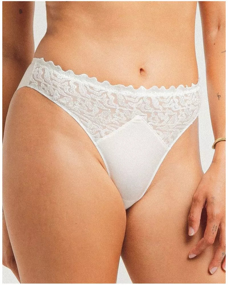 White lace underwear on a plain background