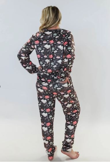 Person wearing a floral pajama set on a white background