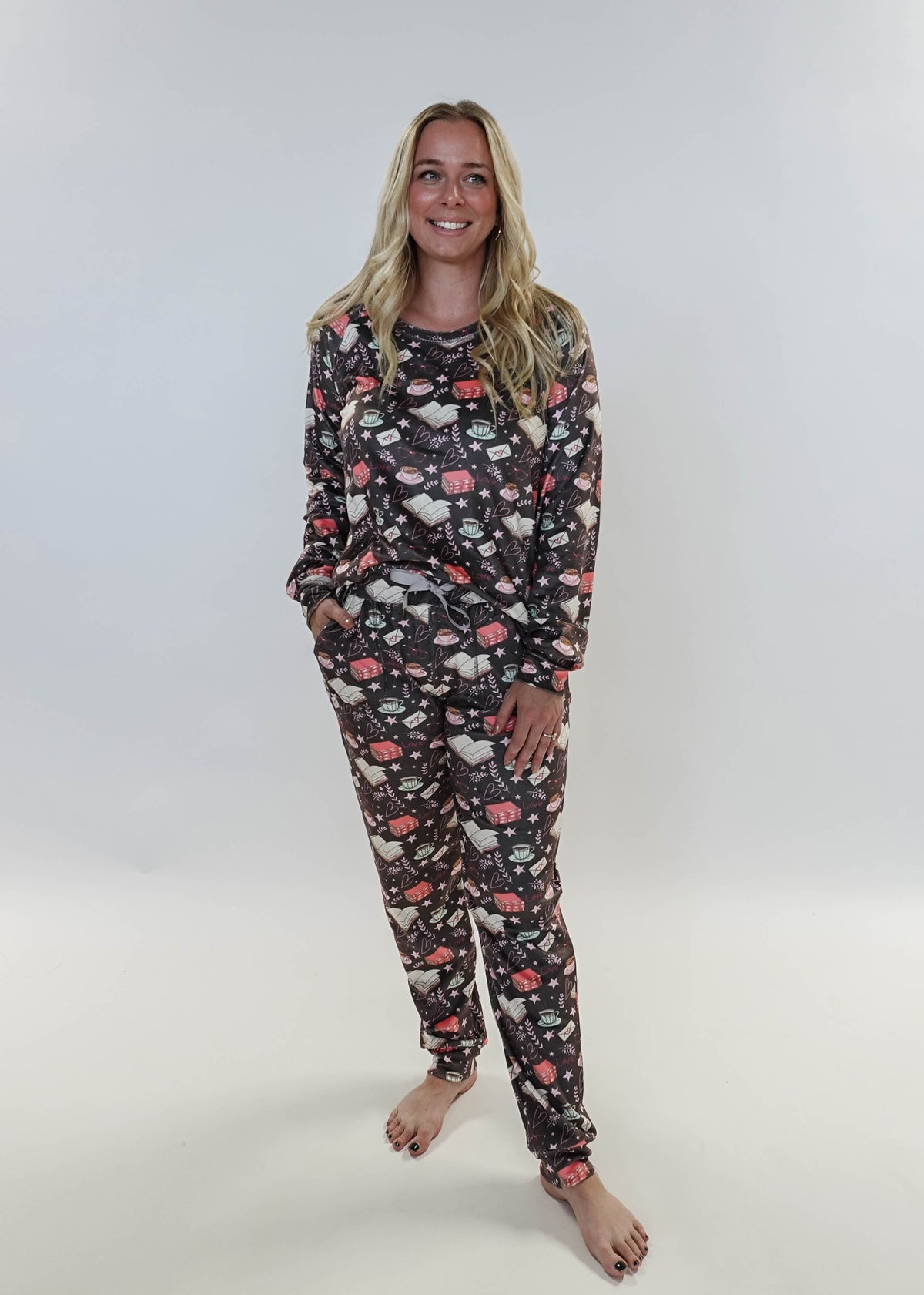 Woman wearing a floral pajama set on a white background