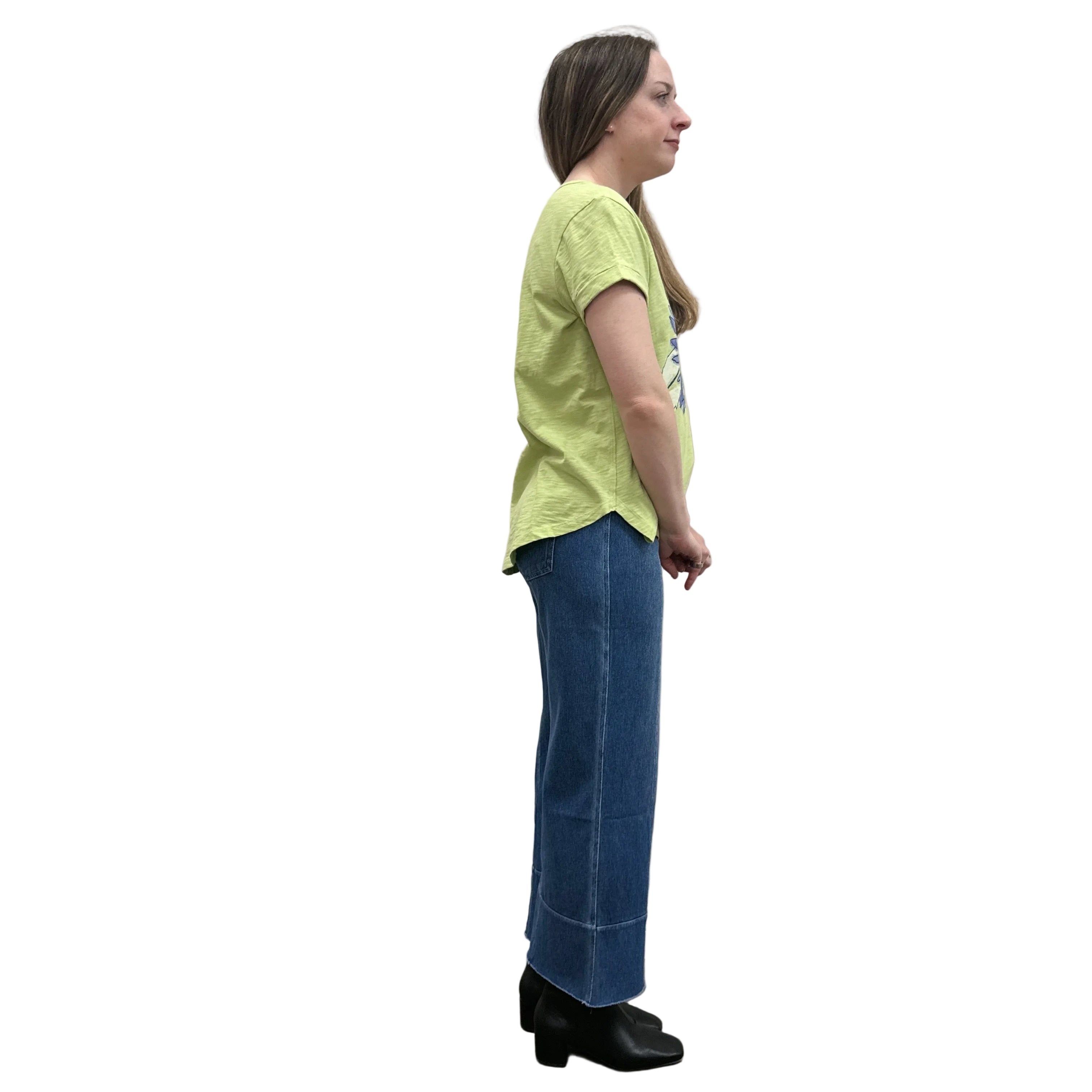 Person wearing a green Papa Cuffed Sleeve shirt and blue pants on white background.