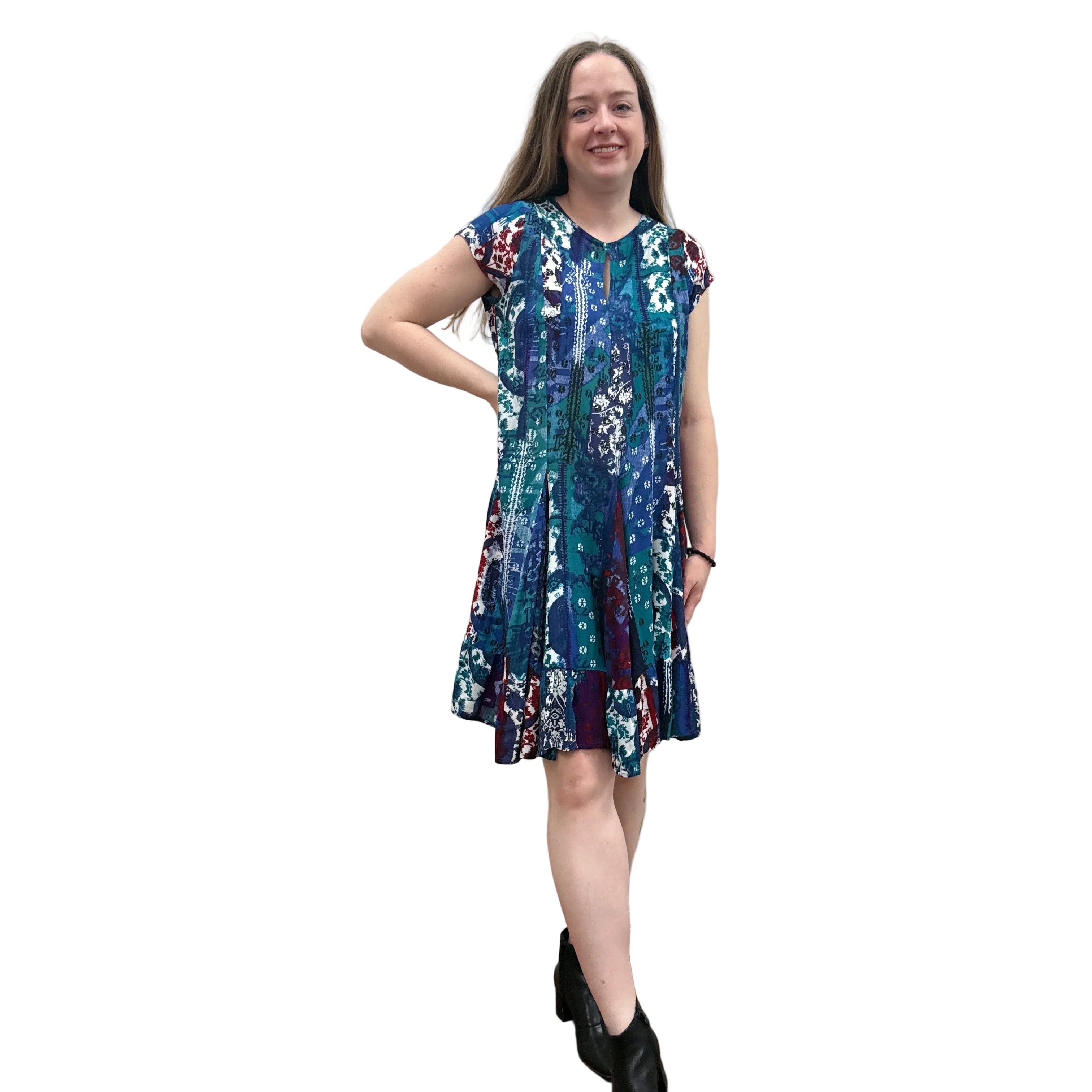 Woman wearing the Papa Indigo Mosaic Breeze patterned dress against a white background.