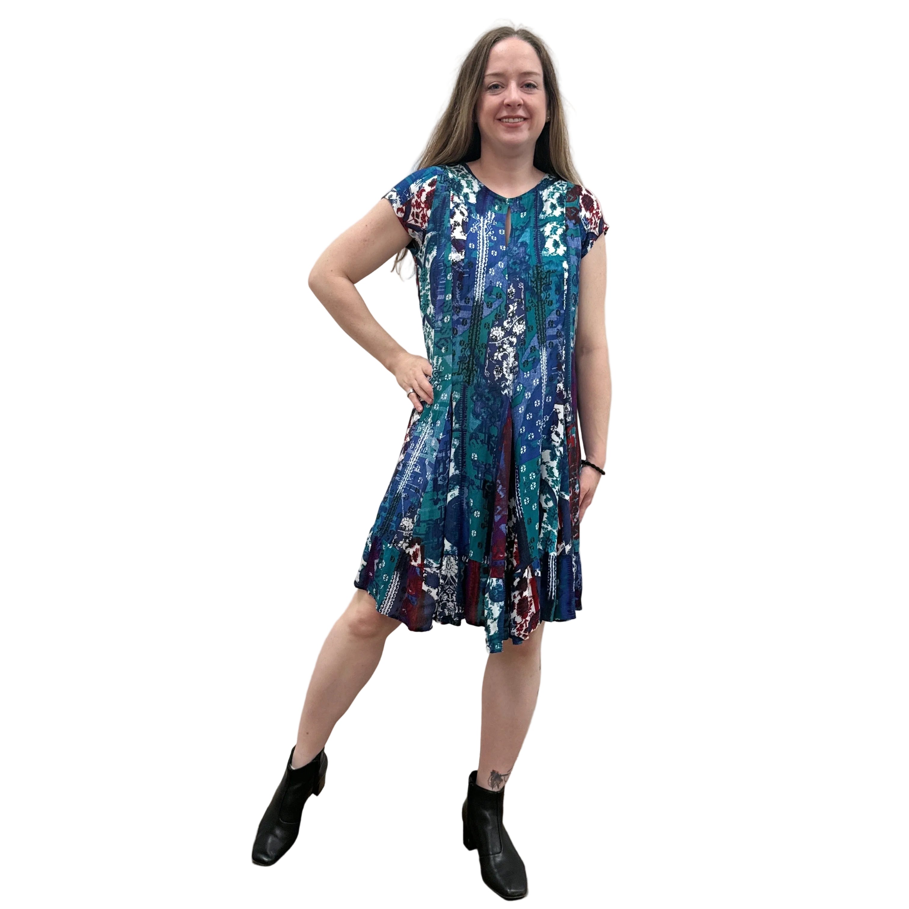 Woman wearing the Papa Indigo Mosaic Breeze patterned dress against a white background.