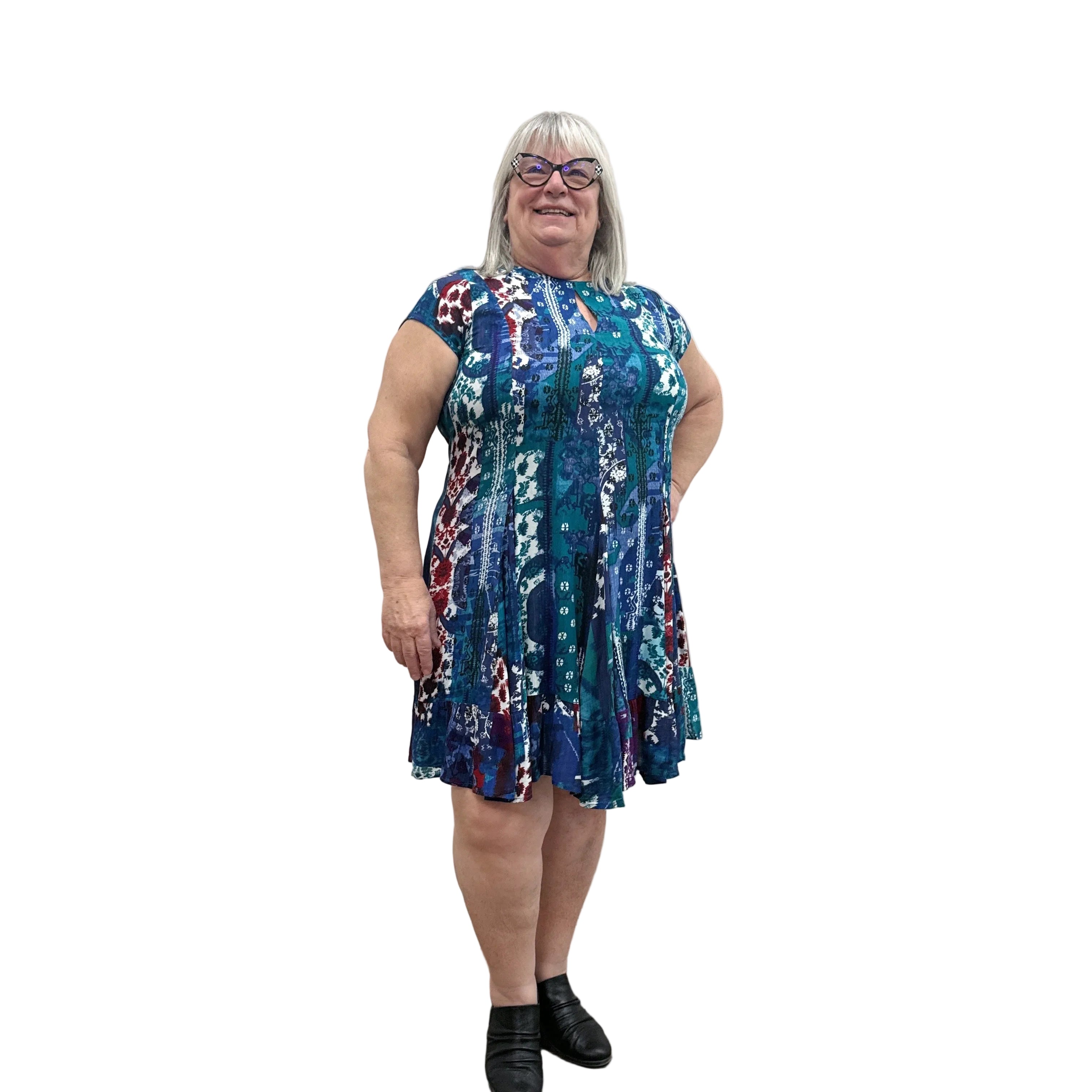 Woman wearing the Papa Indigo Mosaic Breeze patterned dress against a white background.