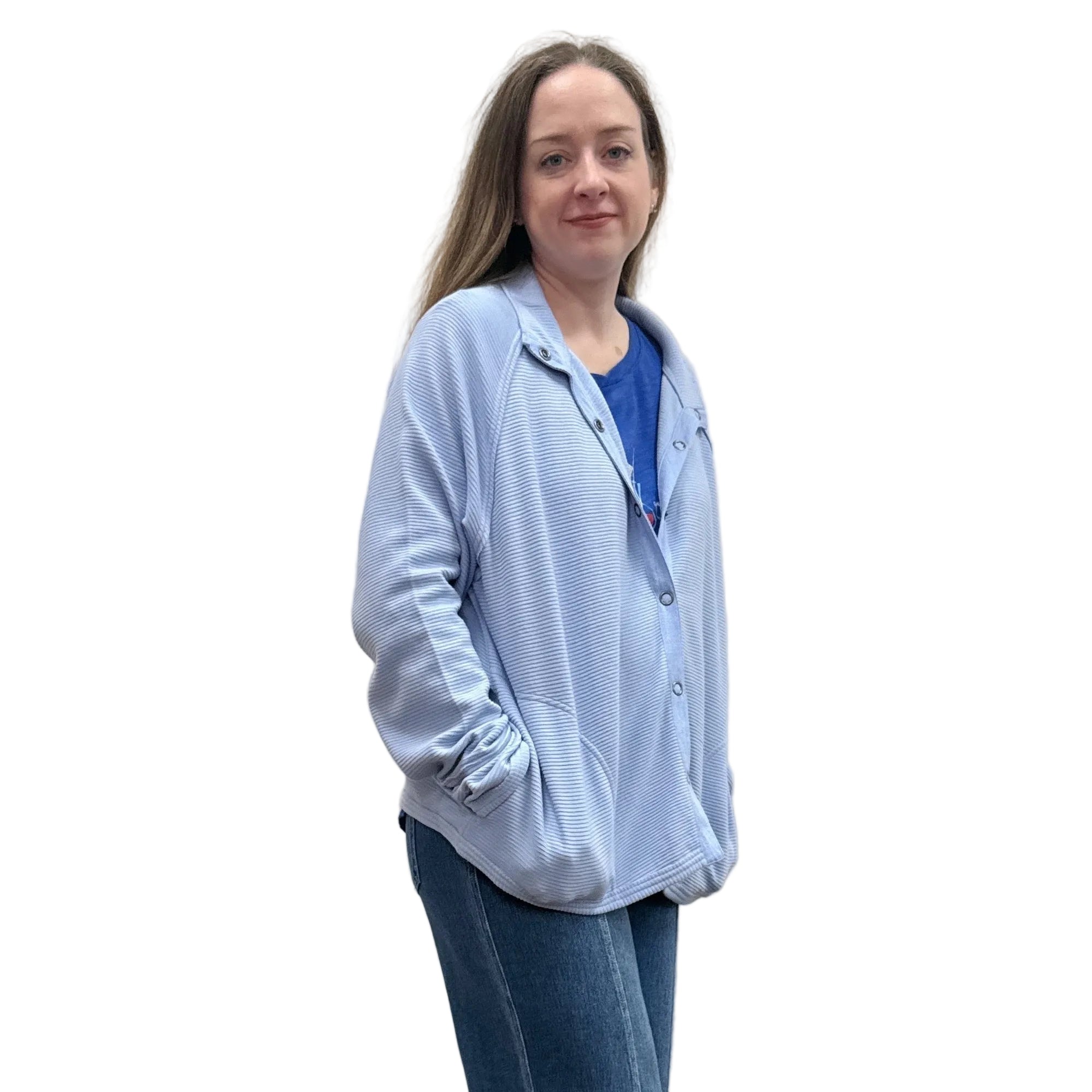 Person wearing a blue Papa Snappy Jacket sweater and jeans on a white background.