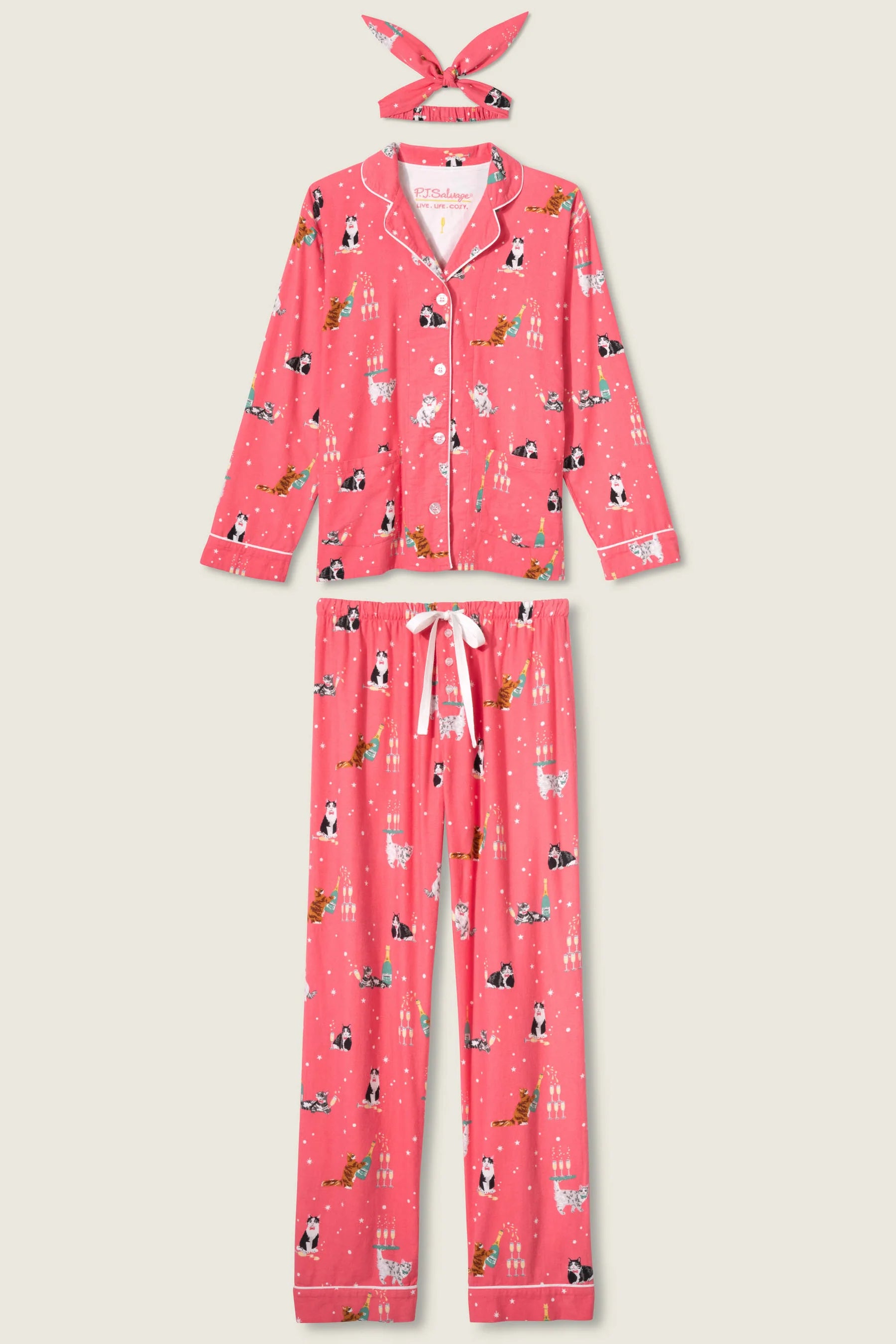 Pink pajama set with animal print on a light beige background