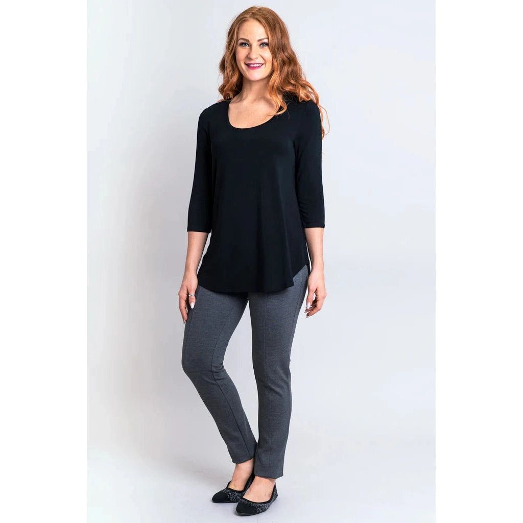 Blue Sky Jazz 3/4 Sleeve Top in Black shown on a model wearing grey leggings standing against a white background, from the front view.