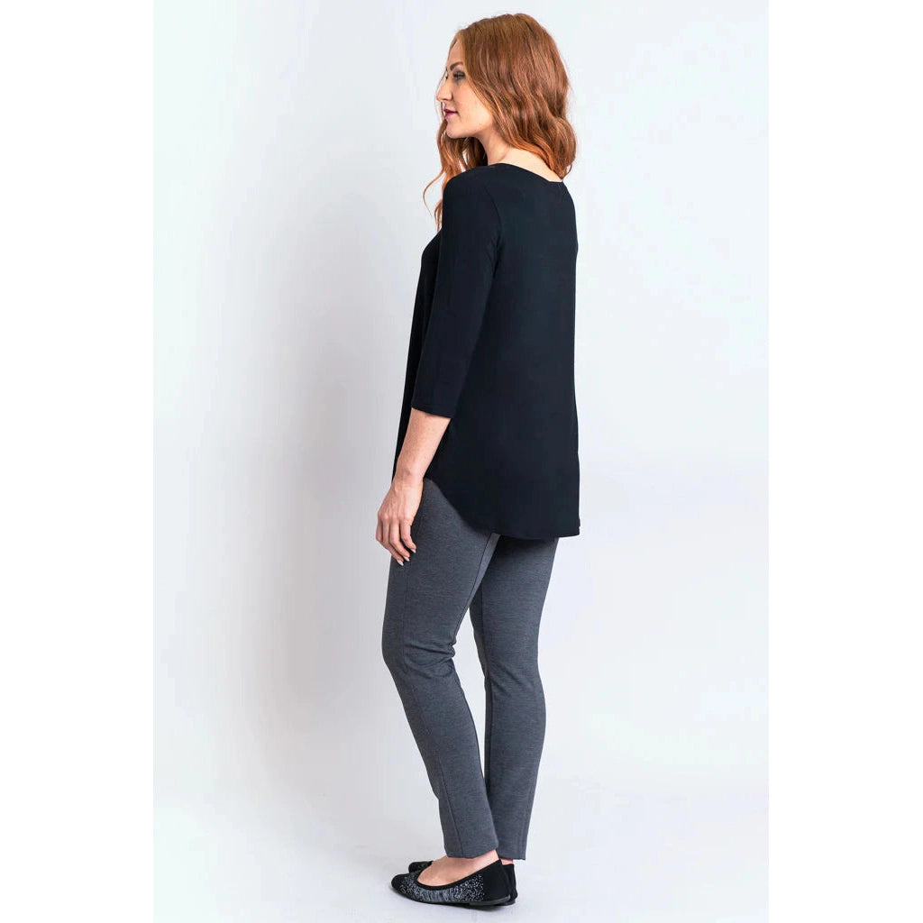 Blue Sky Jazz 3/4 Sleeve Top in Black shown on a model wearing grey leggings standing against a white background, from the back view.