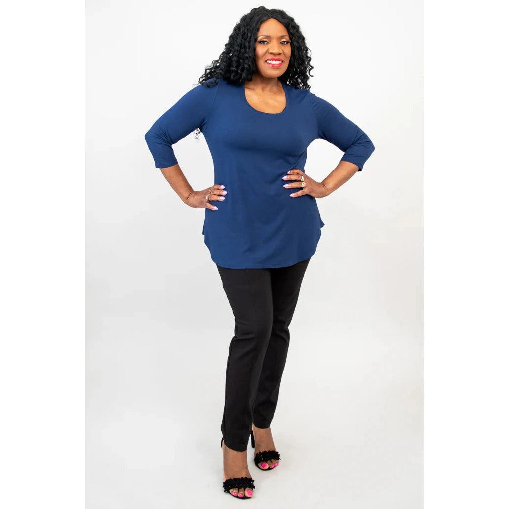 Blue Sky Jazz 3/4 Sleeve Top in Indigo shown on a model wearing black leggings standing against a white background, from the front view.