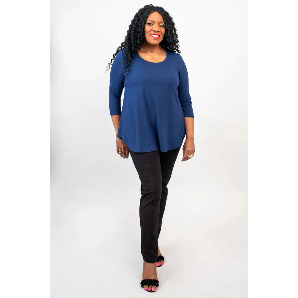 Blue Sky Jazz 3/4 Sleeve Top in Indigo shown on a model wearing black leggings standing against a white background, from the front view.