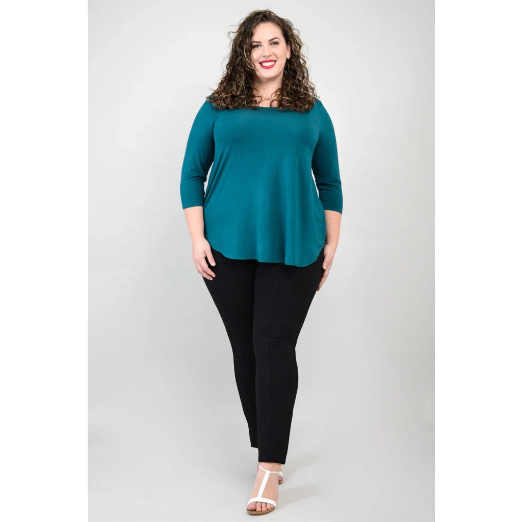 Blue Sky Jazz 3/4 Sleeve Top in Teal shown on a model wearing black leggings against a white background, from the front view.