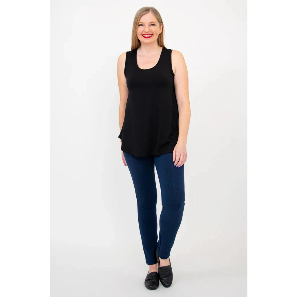 Blue Sky Jazz Tank in Black shown on a model wearing blue leggings standing against a white background, from the front view.