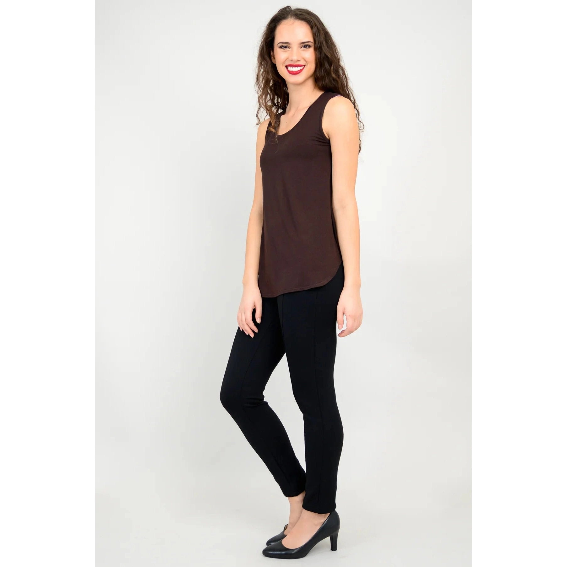 Blue Sky Jazz Tank in Coffee shown on a model wearing black leggings, against a white background, from the front view.